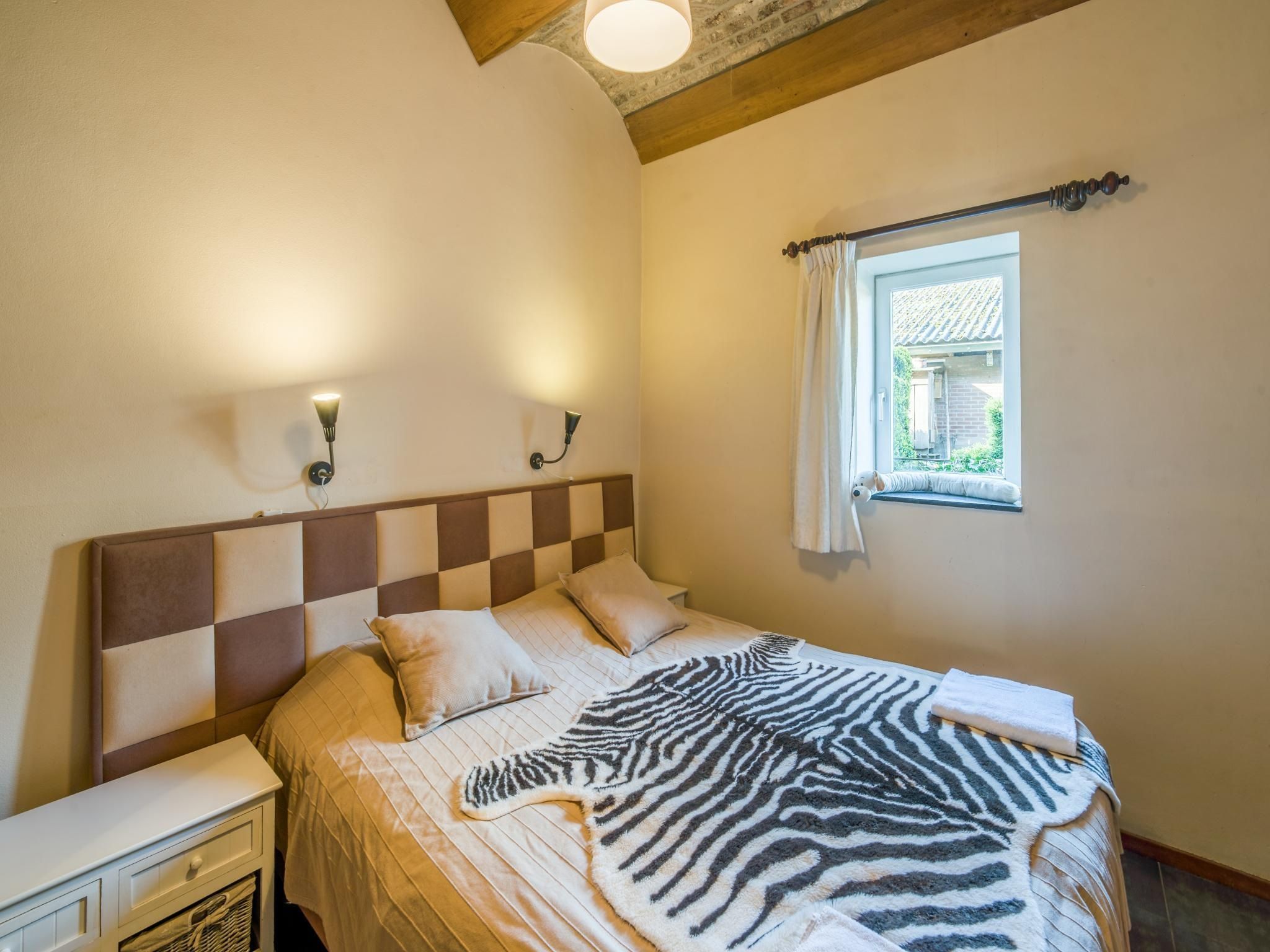 Een slaapkamer van Meschermolen 7 in Mesch-Eijsden