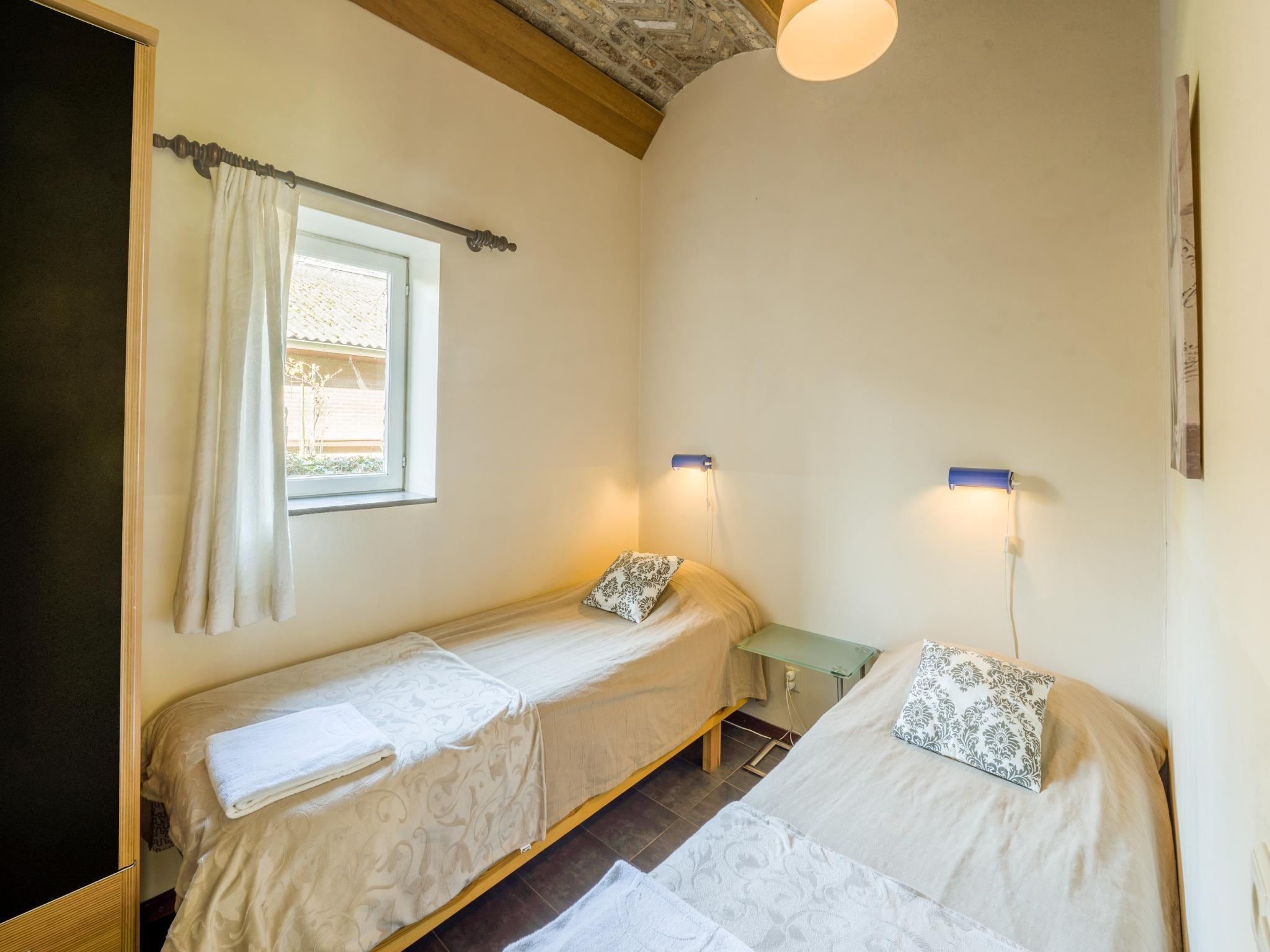 Een slaapkamer van Meschermolen 7 in Mesch-Eijsden