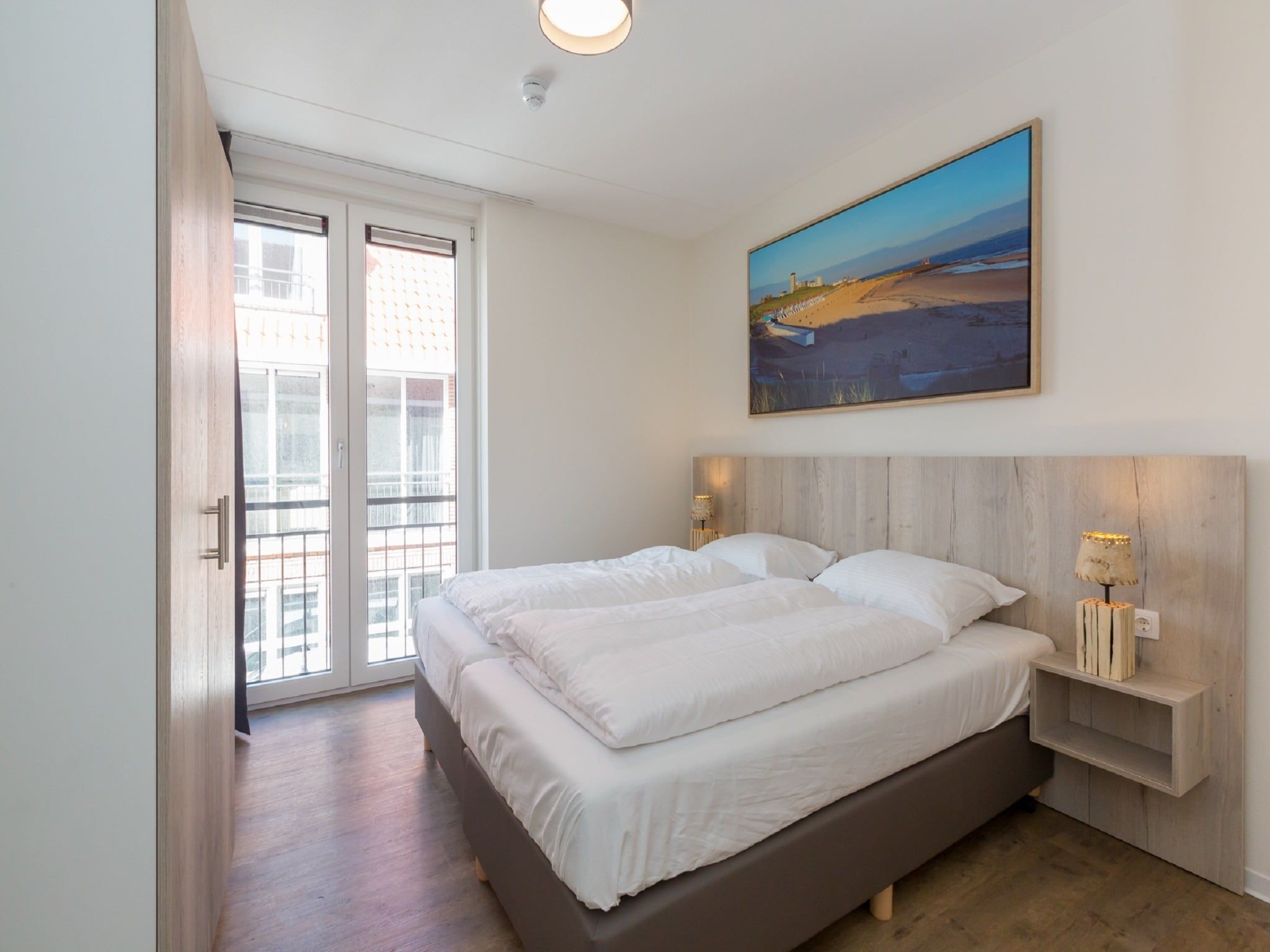 Een slaapkamer van Aparthotel Zoutelande - 4 pers luxe appartement in Zoutelande