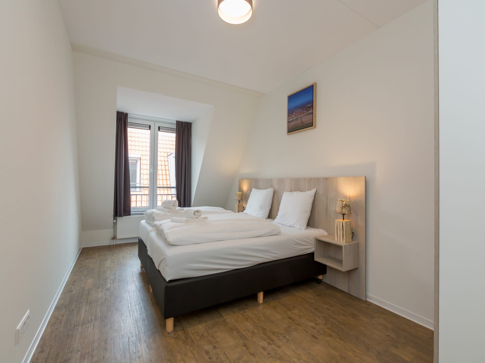 Een slaapkamer van Aparthotel Zoutelande - 4 pers luxe appartement in Zoutelande