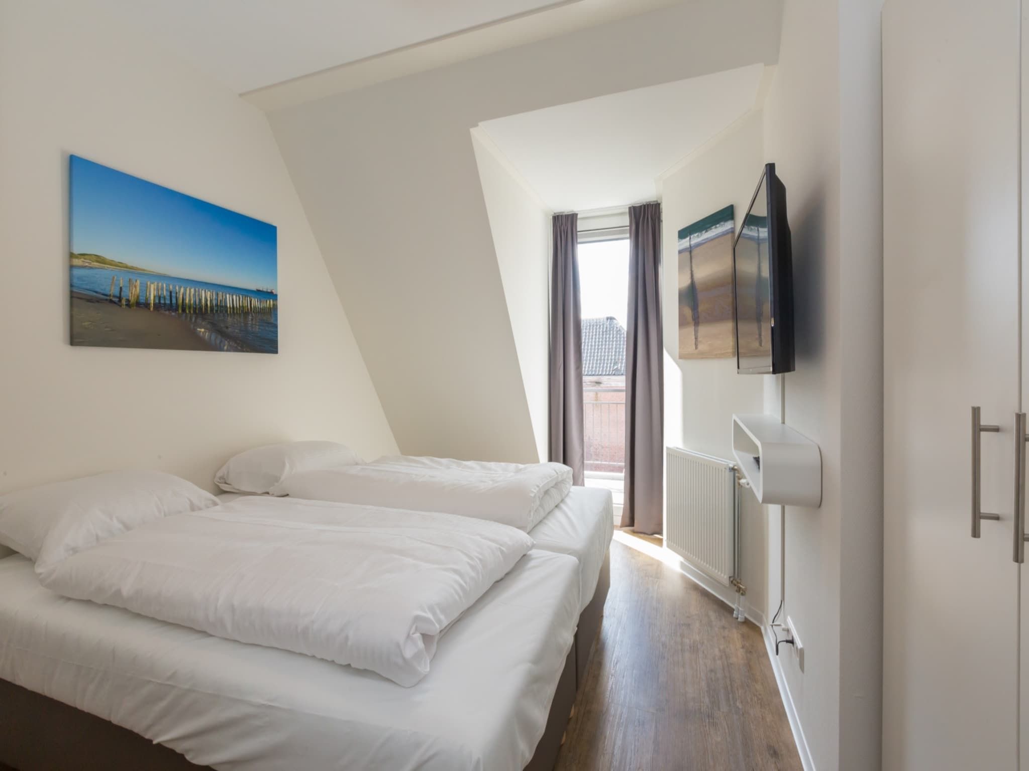 Een slaapkamer van Aparthotel Zoutelande - 6 pers luxe appartement in Zoutelande