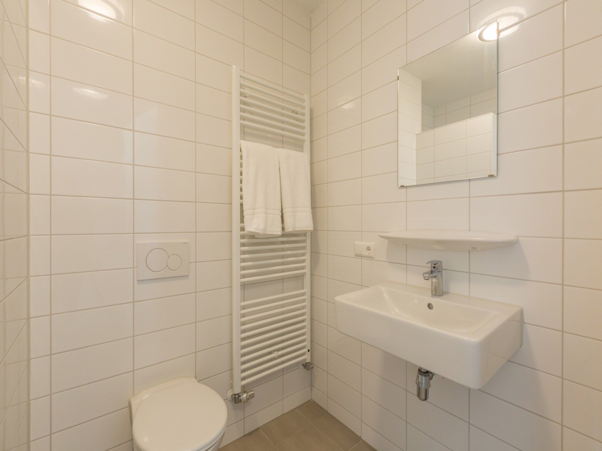 De badkamer van Aparthotel Zoutelande - 6 pers luxe appartement in Zoutelande
