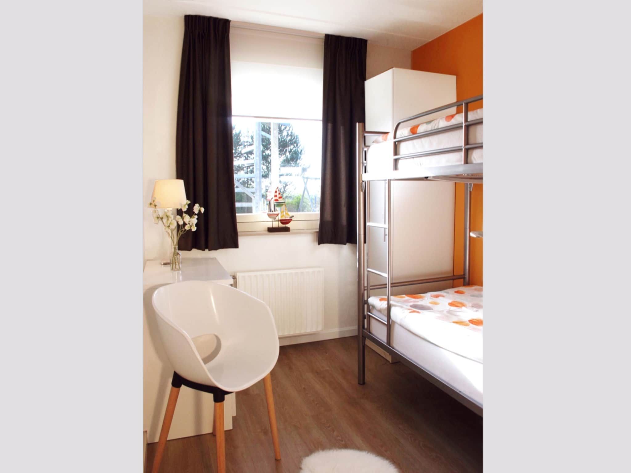 Een slaapkamer van Ostrea 16 in Kamperland