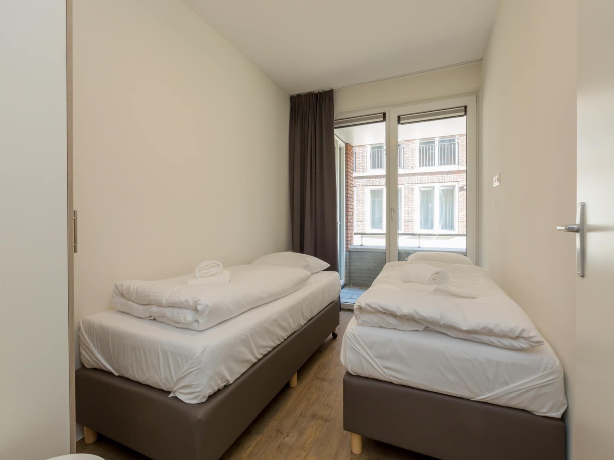 Een slaapkamer van Aparthotel Zoutelande - 4 pers luxe appartement - huisdier in Zoutelande