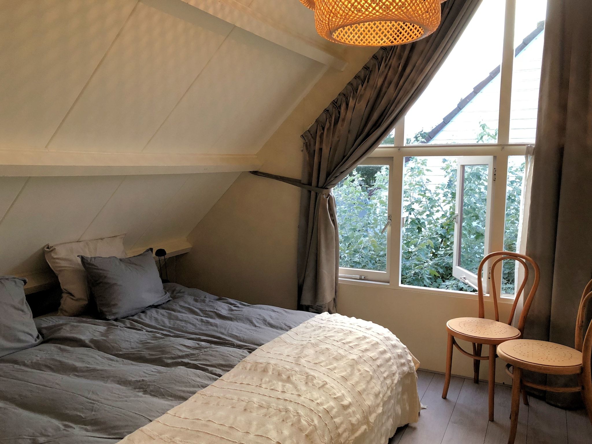 Een slaapkamer van June's Cabin in Noordwijkerhout