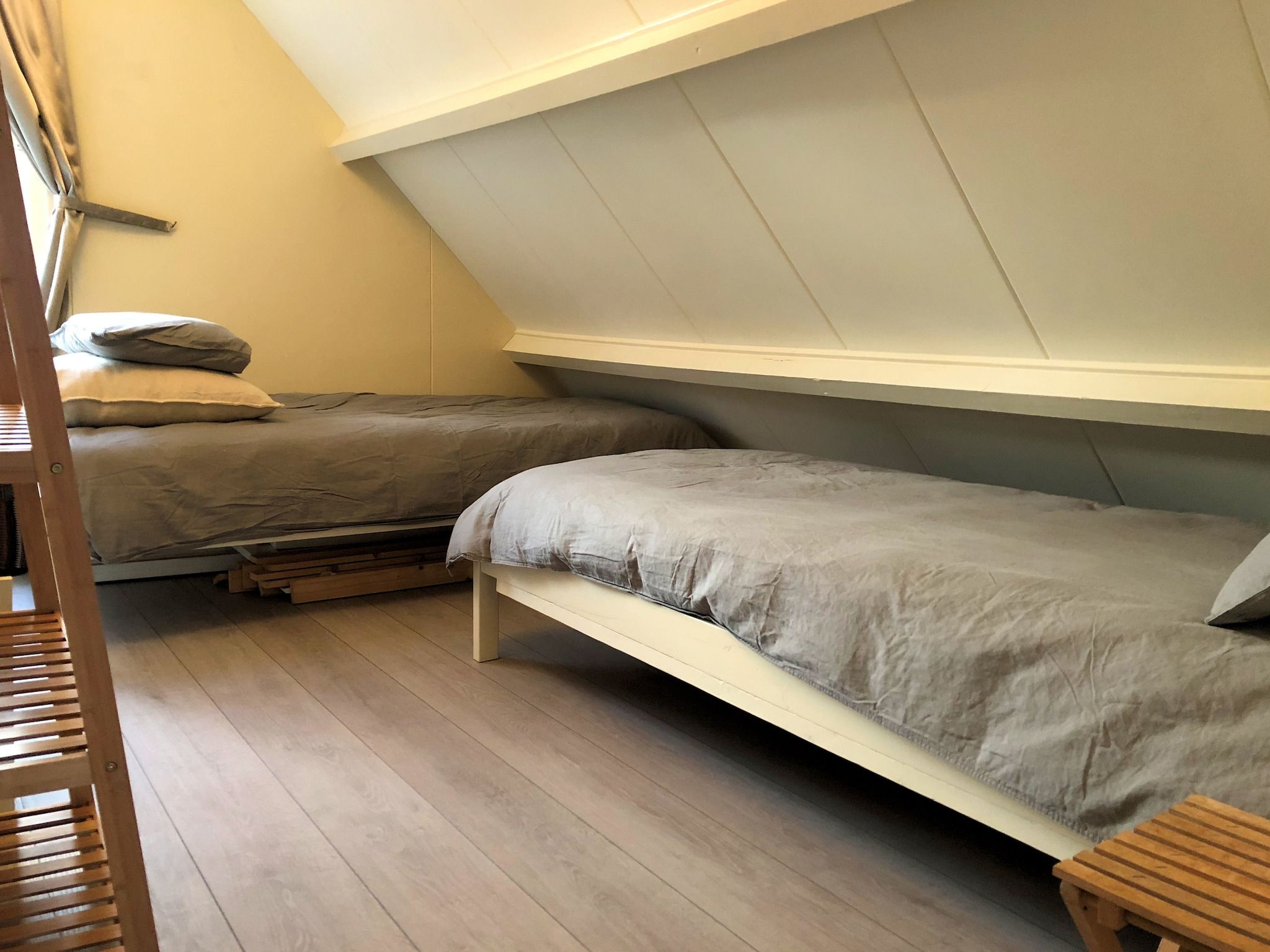 Een slaapkamer van June's Cabin in Noordwijkerhout