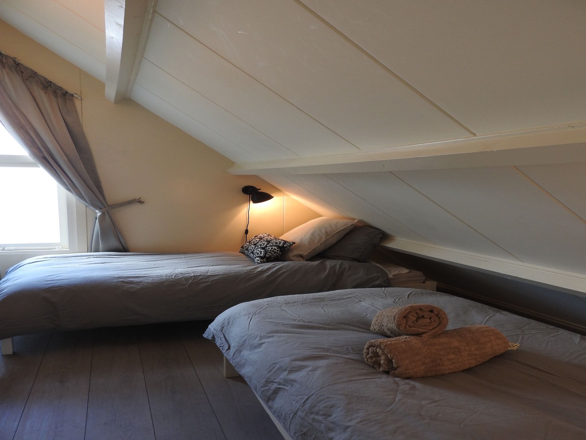Een slaapkamer van June's Cabin in Noordwijkerhout