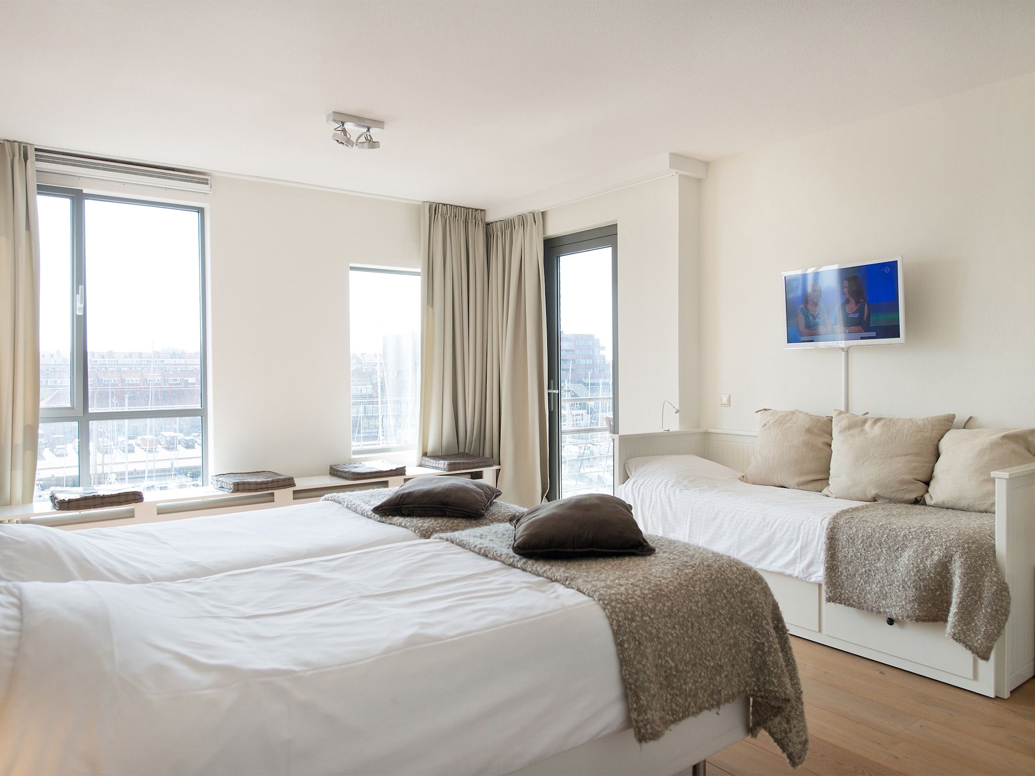 Een slaapkamer van Scheveningen Harbour 24a in Scheveningen