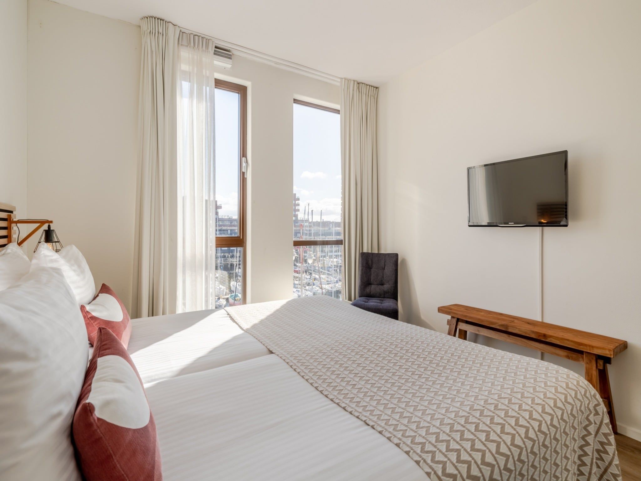 Een slaapkamer van Scheveningen Harbour 60 in Scheveningen