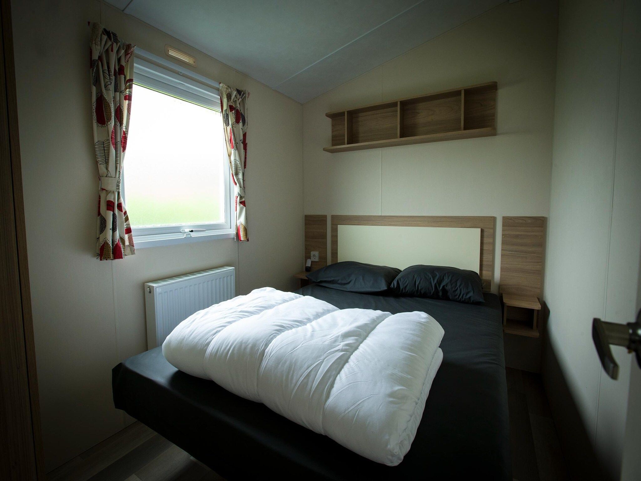 Een slaapkamer van Recreatiepark Duinhoeve 12 in Udenhout