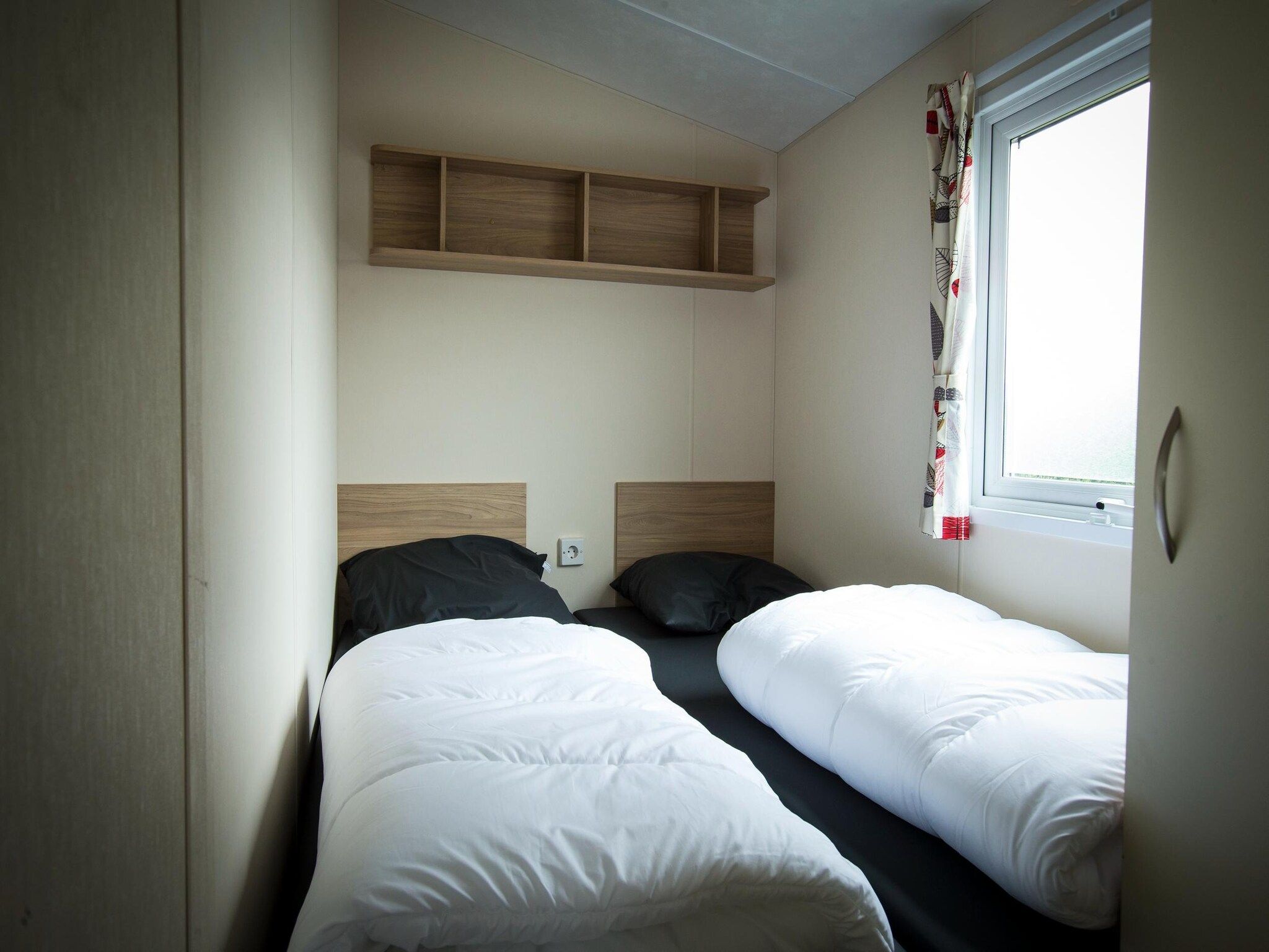 Een slaapkamer van Recreatiepark Duinhoeve 12 in Udenhout