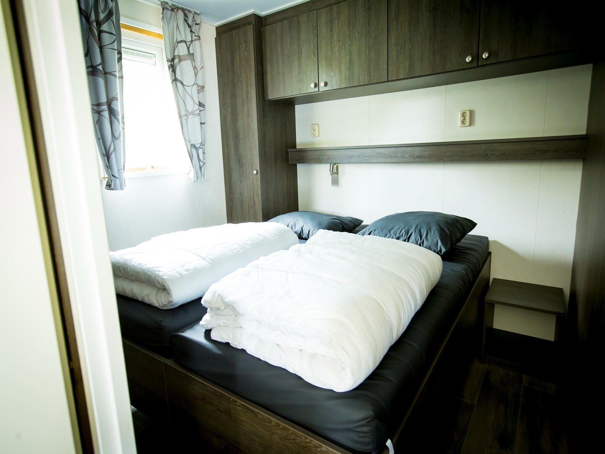 Een slaapkamer van Recreatiepark Duinhoeve 14 in Udenhout