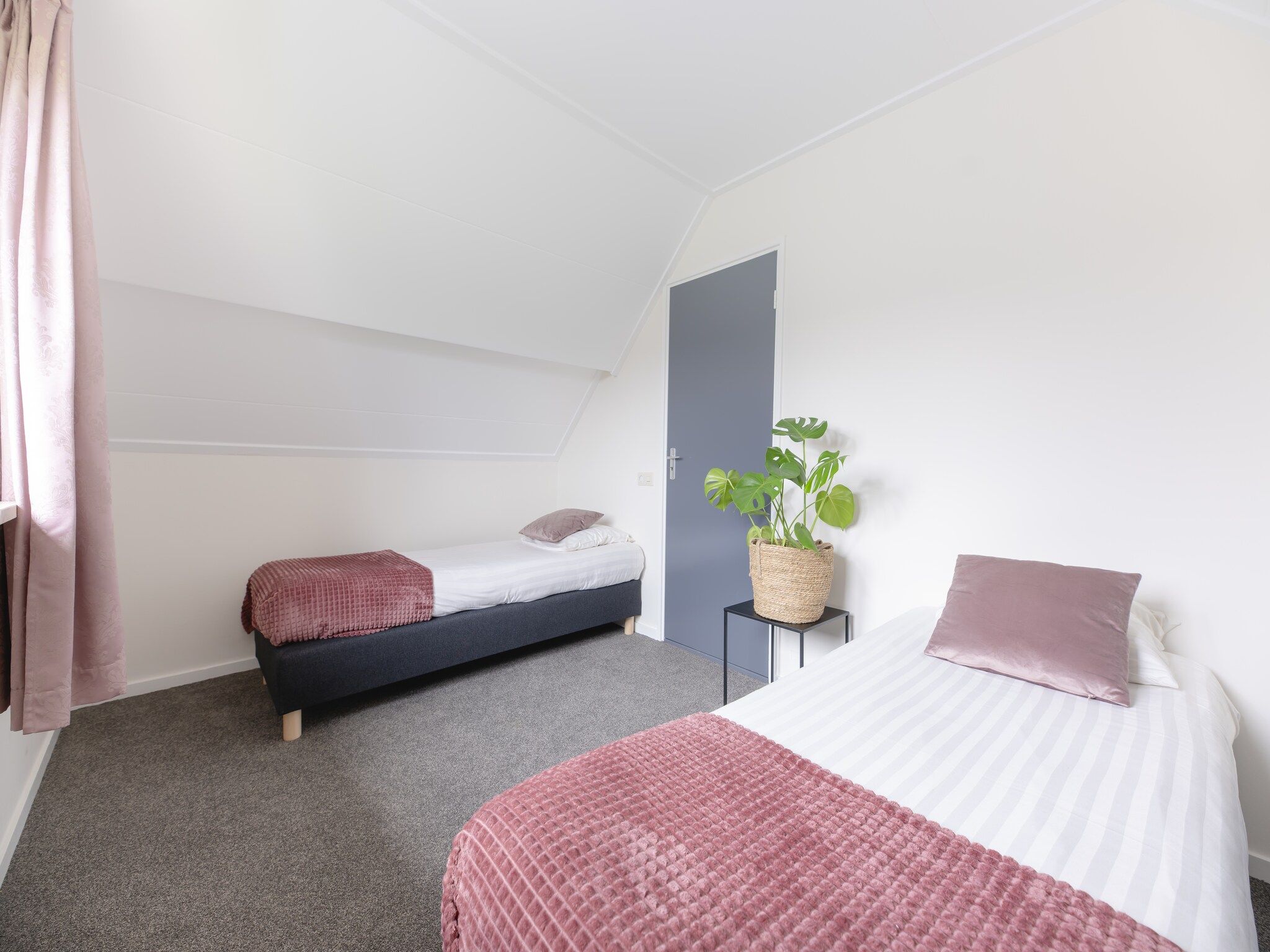 Een slaapkamer van Vakantiepark Mölke 16 in Zuna