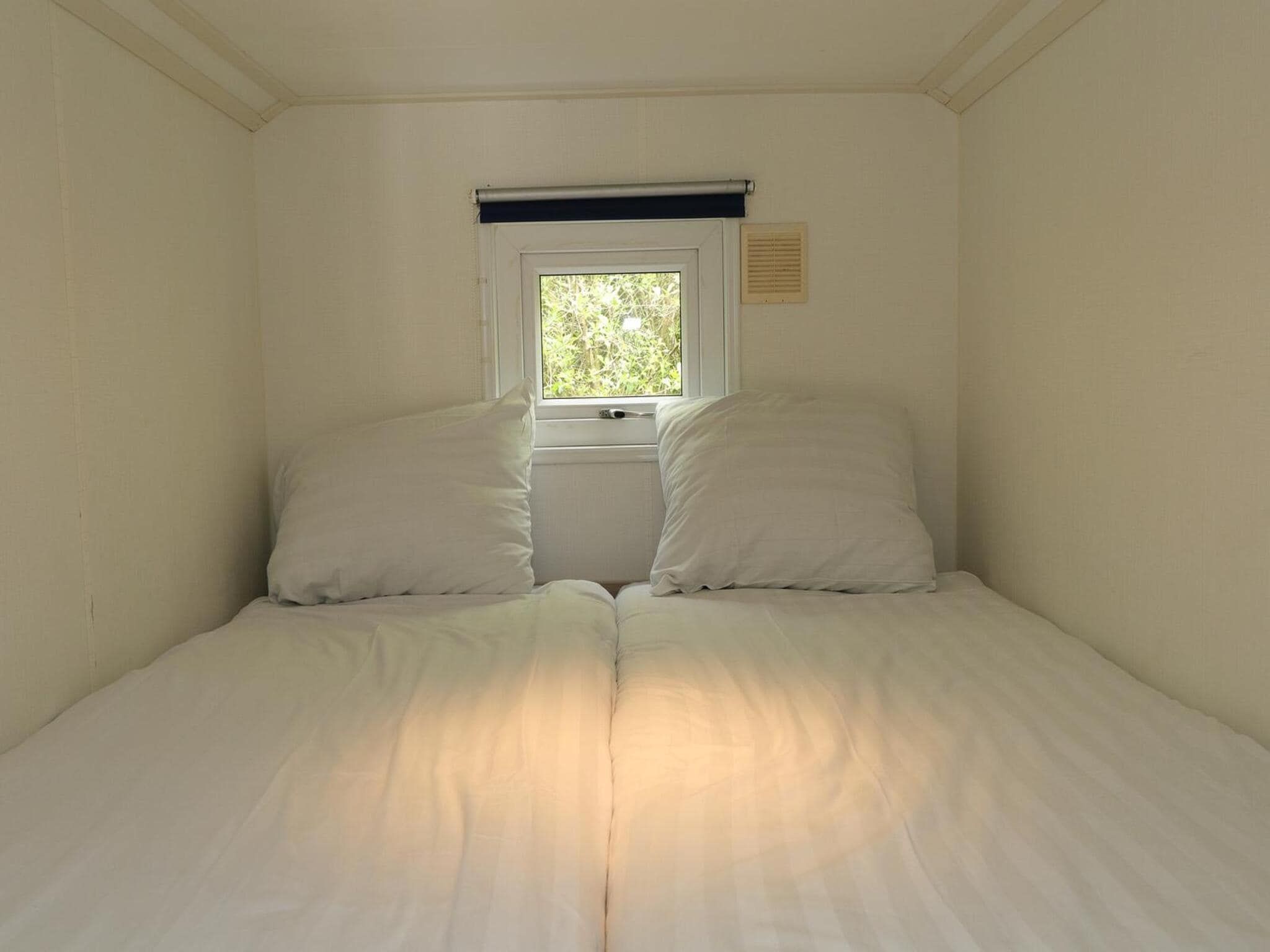 Een slaapkamer van Boslodge 6 in Otterlo