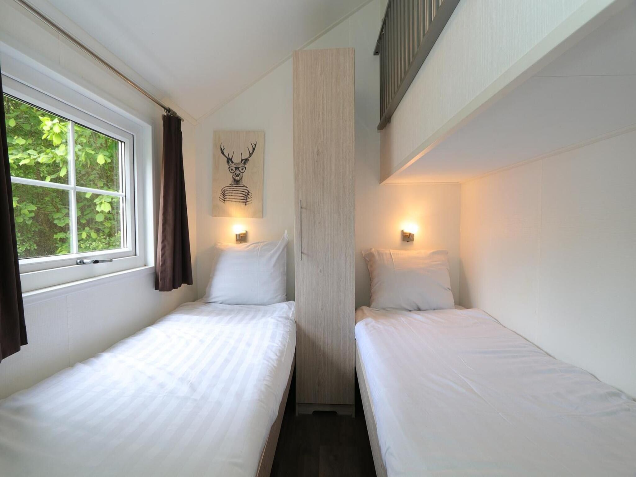 Een slaapkamer van Boslodge 6 in Otterlo
