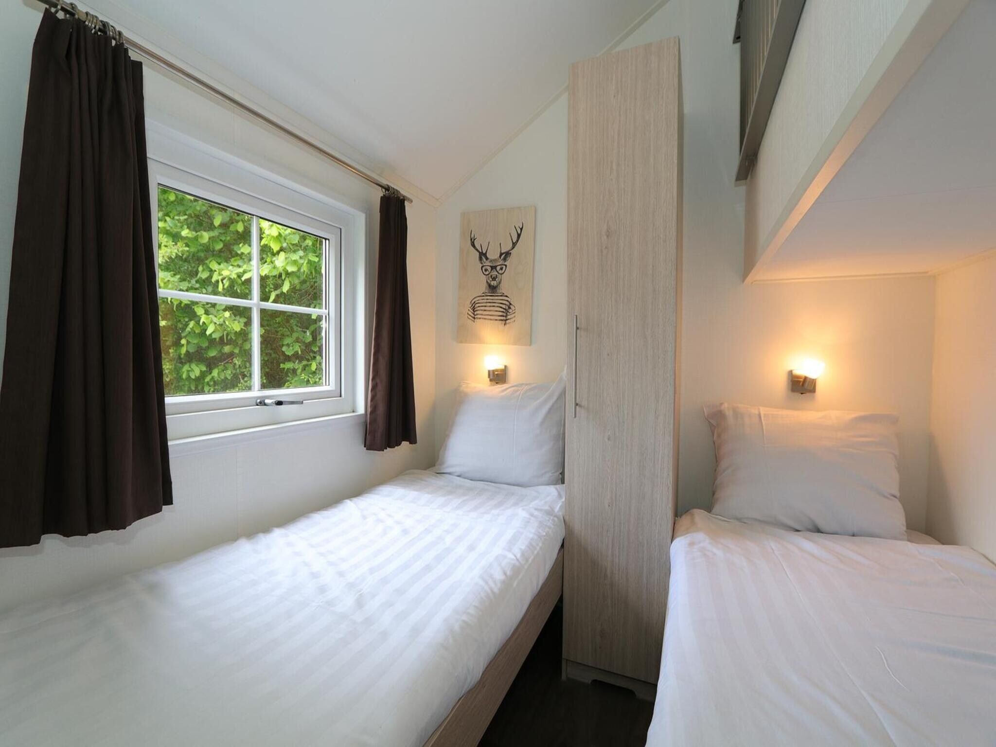 Een slaapkamer van Boslodge 6 in Otterlo