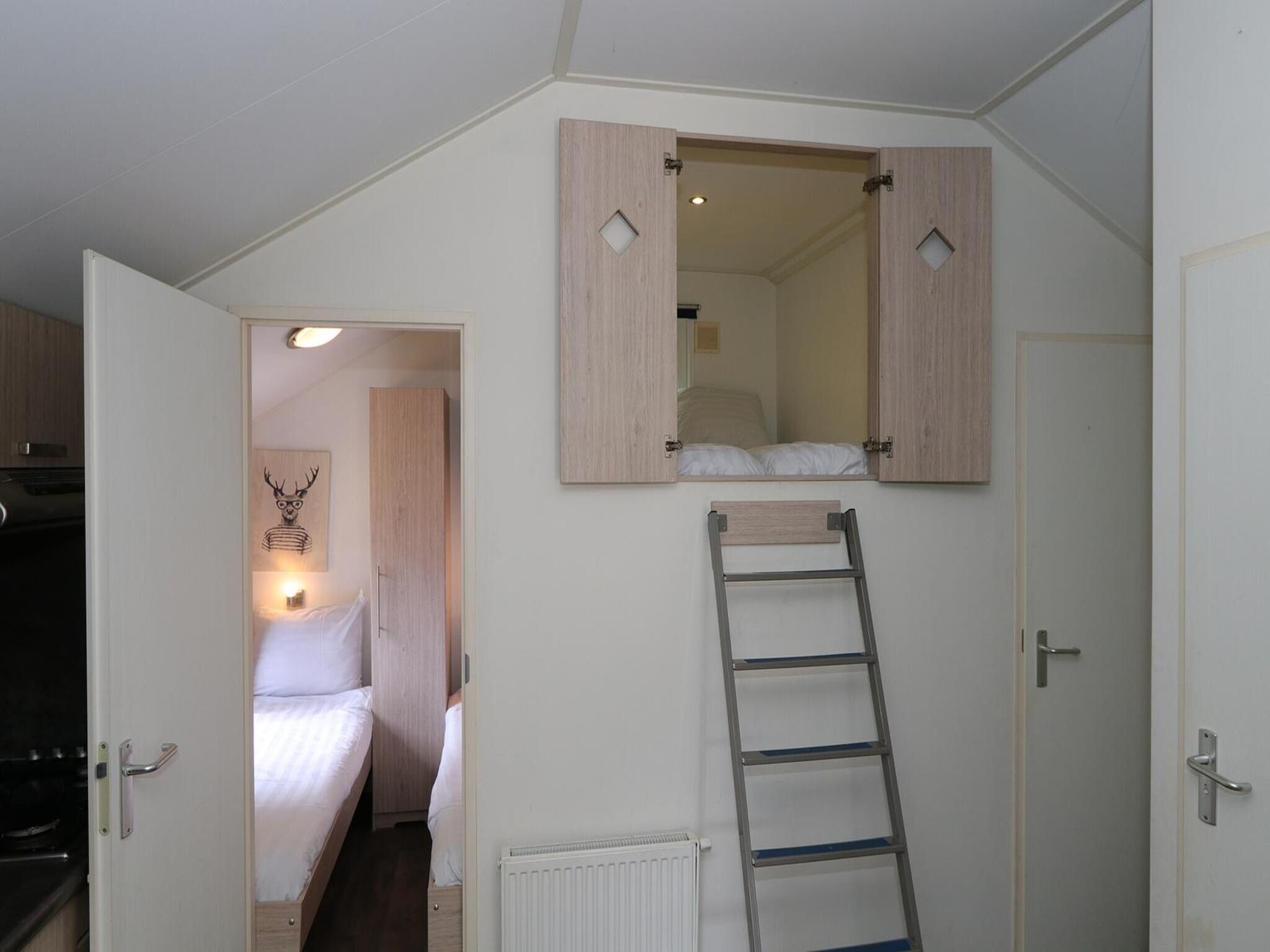 Een slaapkamer van Boslodge 6 in Otterlo
