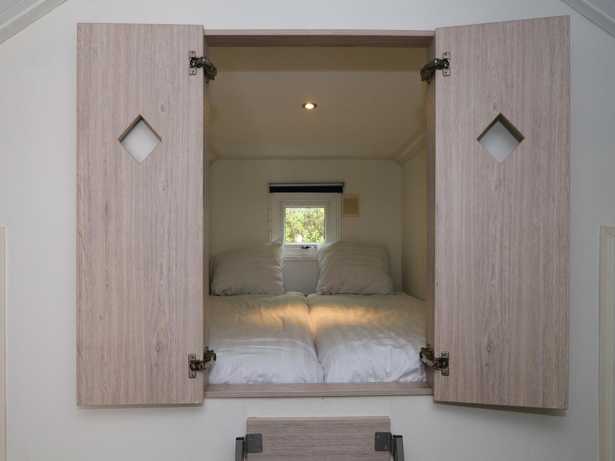 Een slaapkamer van Boslodge 6 in Otterlo