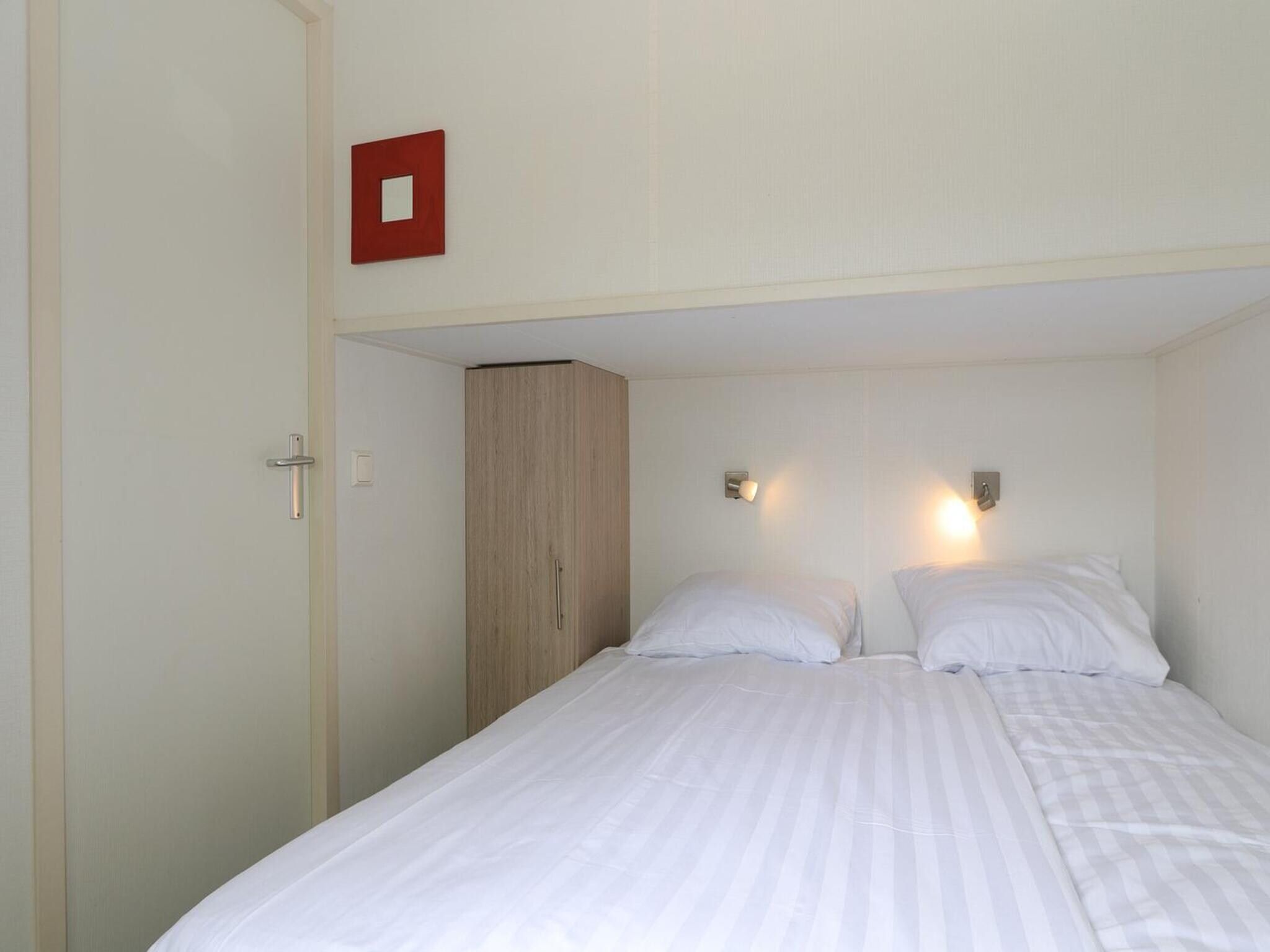 Een slaapkamer van Boslodge 6 in Otterlo