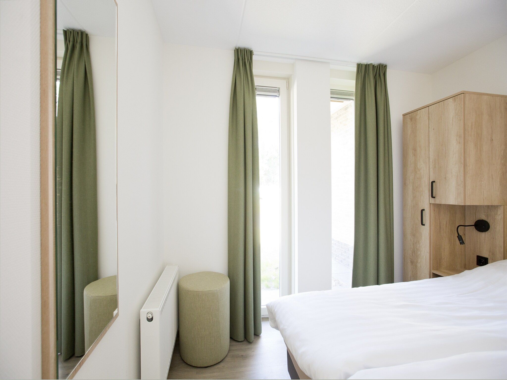 Een slaapkamer van Landgoed De IJsvogel 7 in Voorthuizen