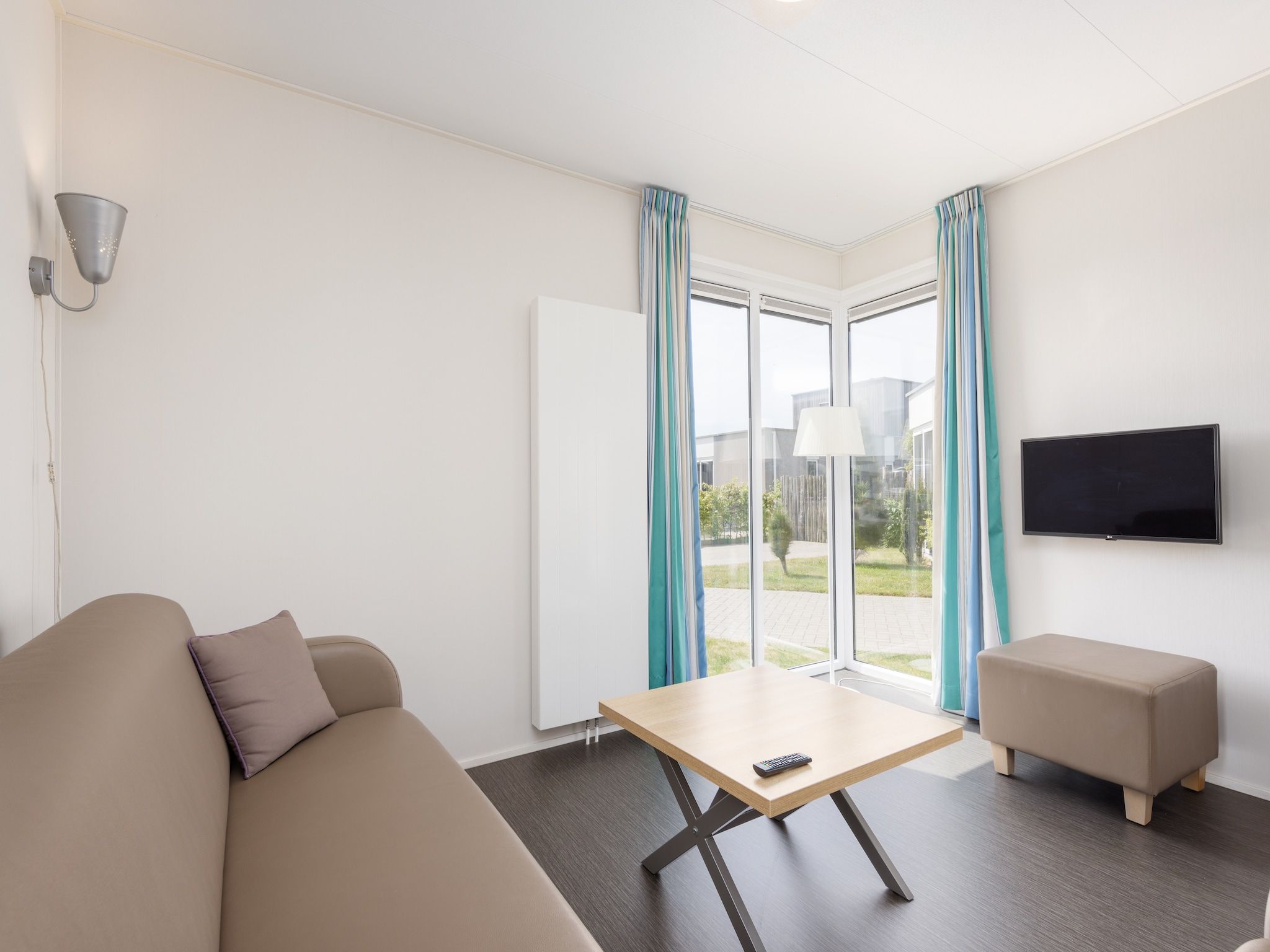 De woonkamer van Vakantiepark Callassande 3 in Callantsoog