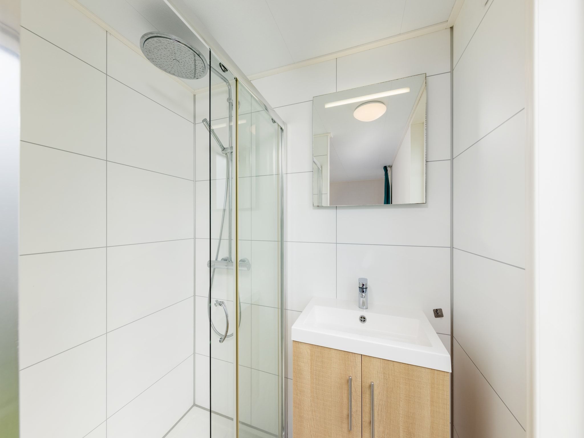 De badkamer van Vakantiepark Callassande 3 in Callantsoog