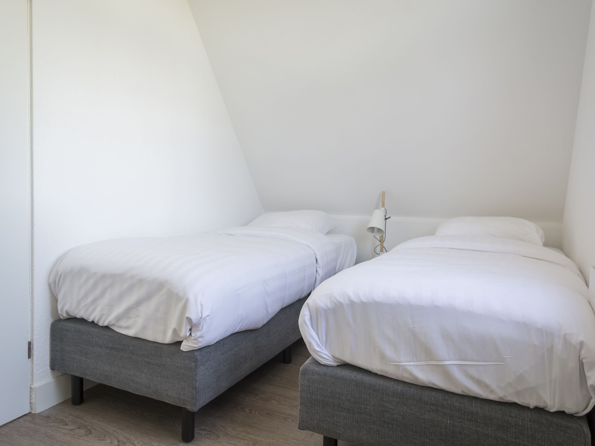 Een slaapkamer van Bouwlust E9 in De Cocksdorp Texel