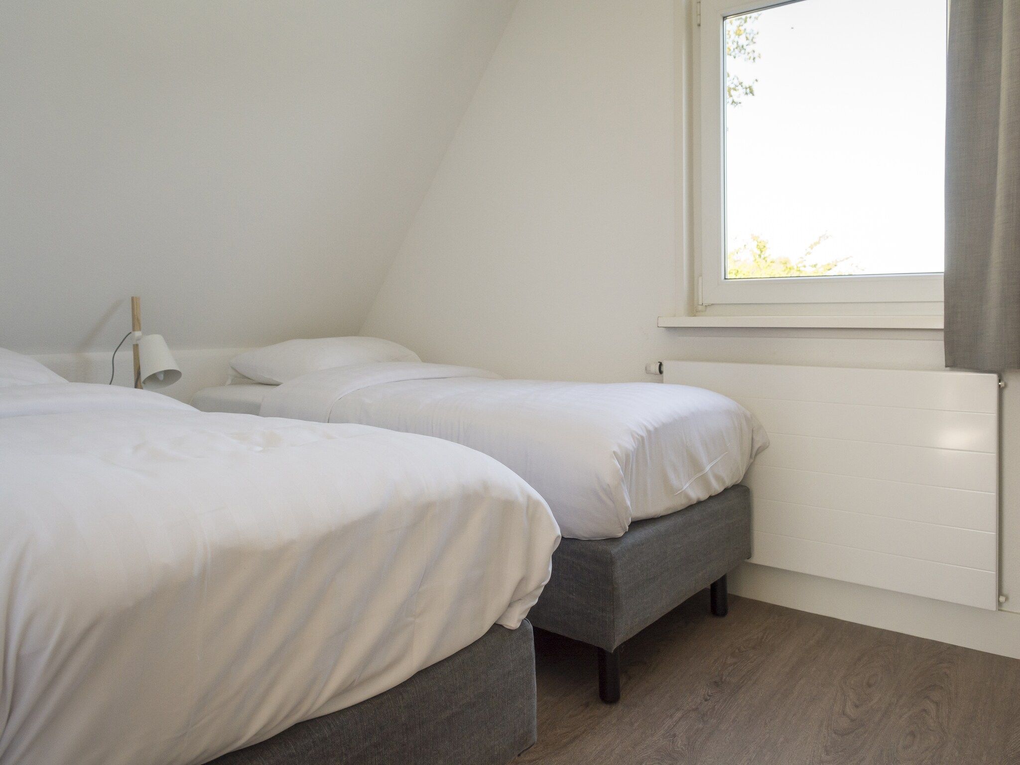Een slaapkamer van Bouwlust E9 in De Cocksdorp Texel