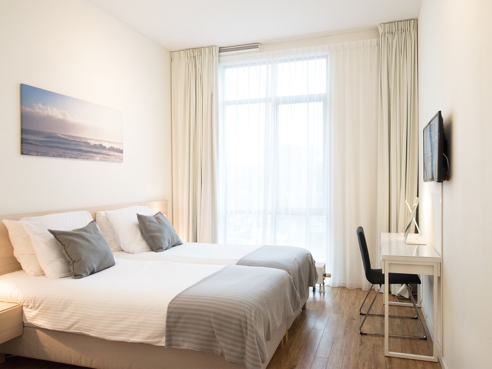 Een slaapkamer van Scheveningen Harbour 54c in Scheveningen
