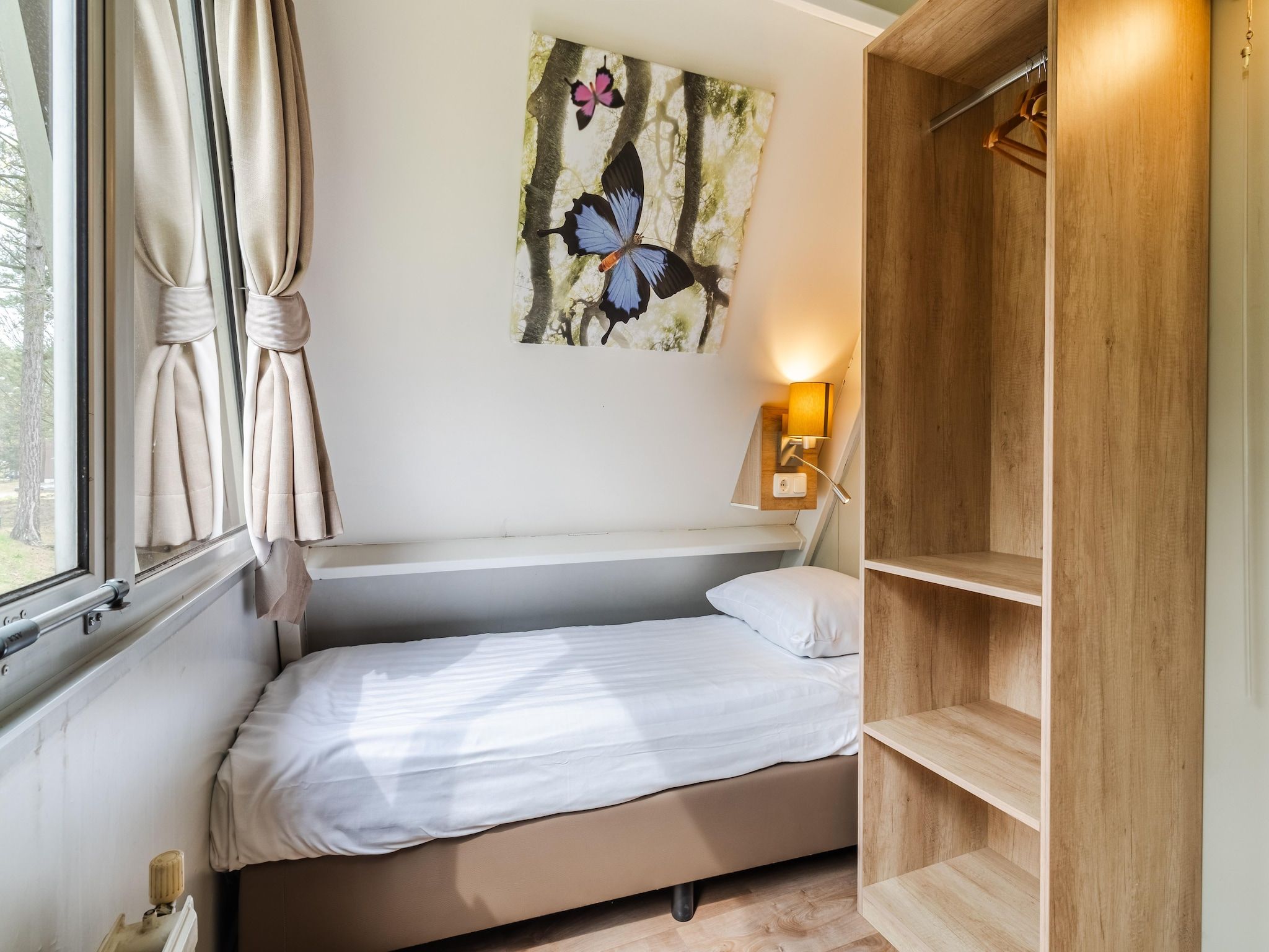 Een slaapkamer van Bospark 't Wolfsven 7 in Mierlo