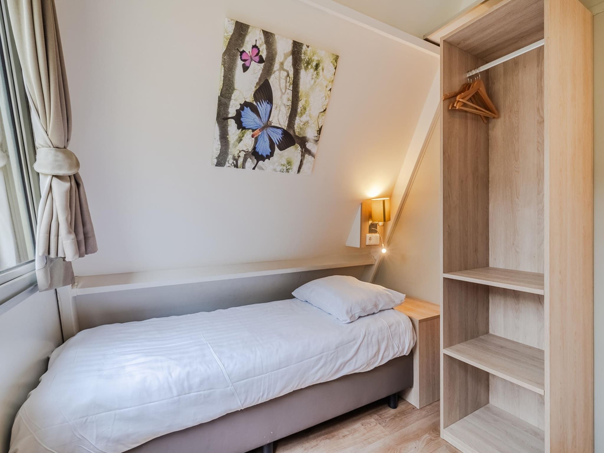 Een slaapkamer van Bospark 't Wolfsven 8 in Mierlo