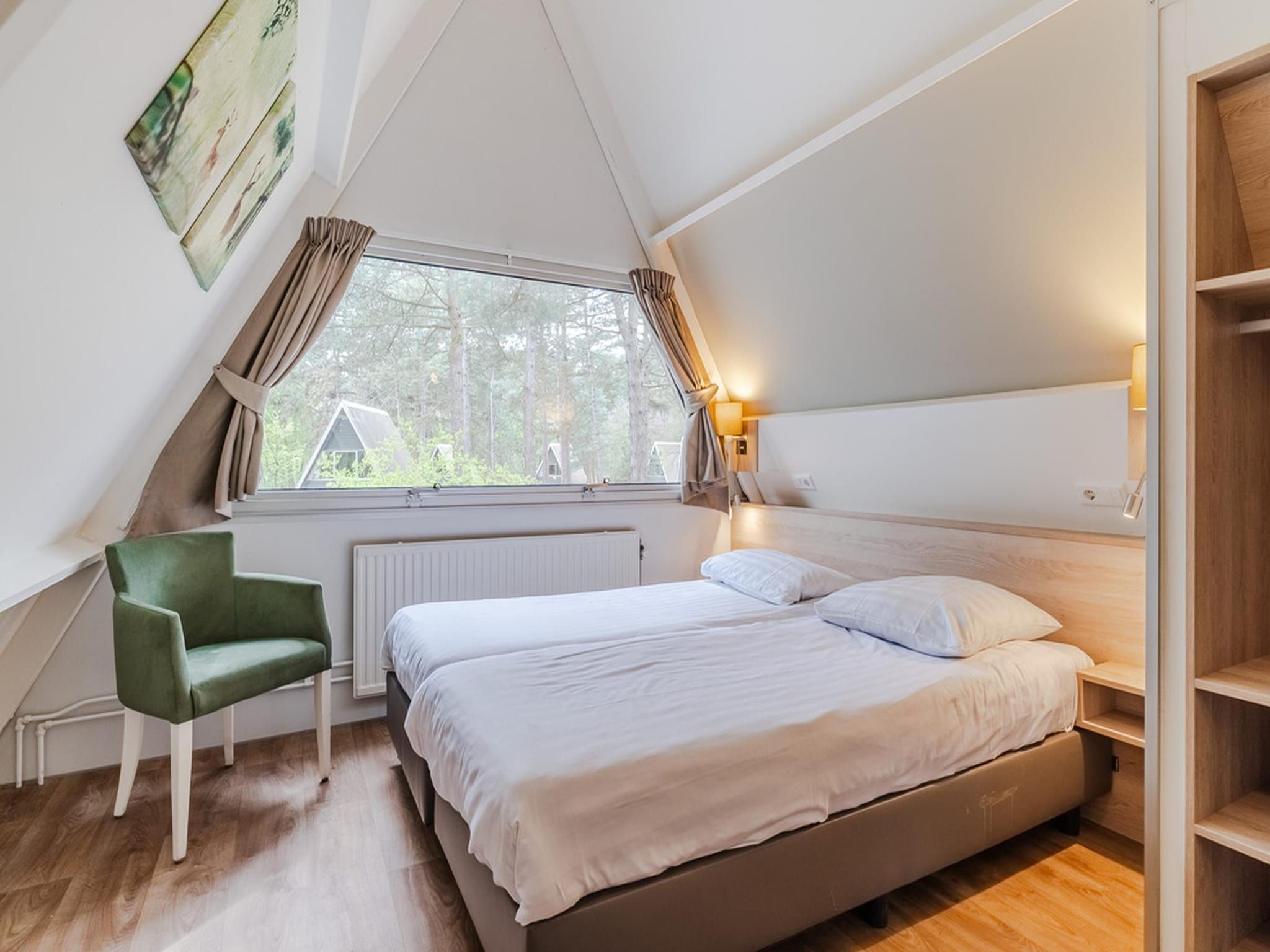 Een slaapkamer van Bospark 't Wolfsven 8 in Mierlo