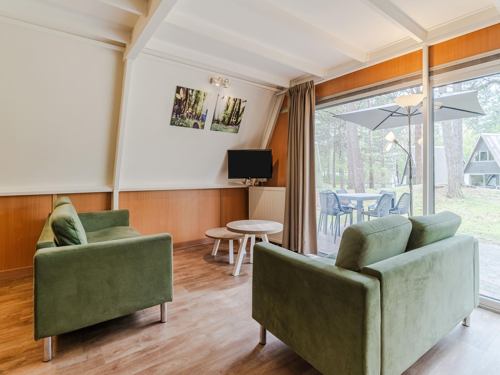 De woonkamer van Bospark 't Wolfsven 8 in Mierlo