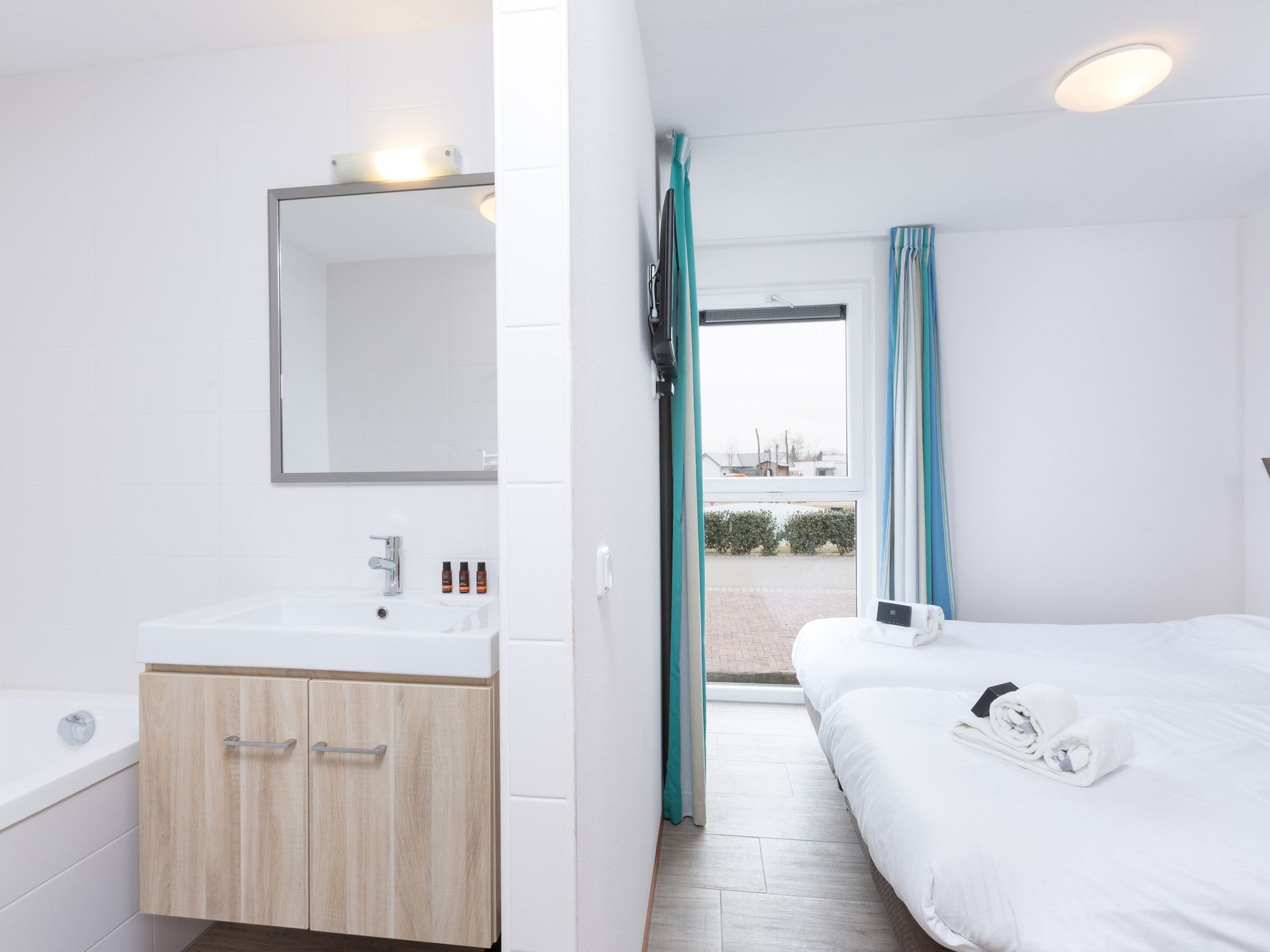 Een slaapkamer van Strandpark Duynhille 3 in Ouddorp