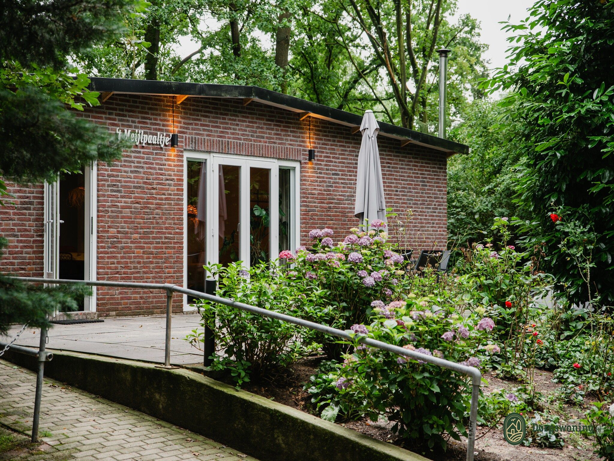 De buitenkant van Dorpswoning In het Bos in Leende