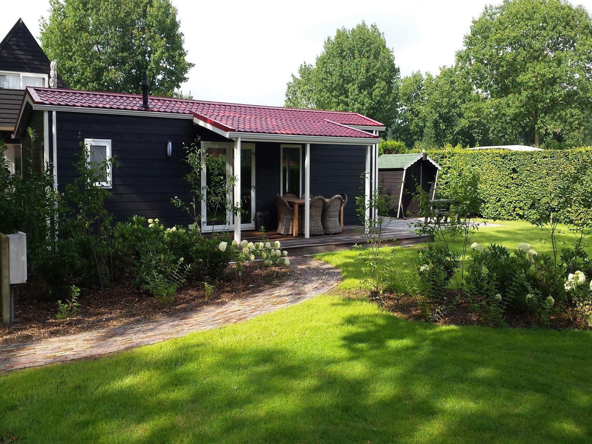 De buitenkant van Vakantiepark de Tabaksschuur 3 in Elst