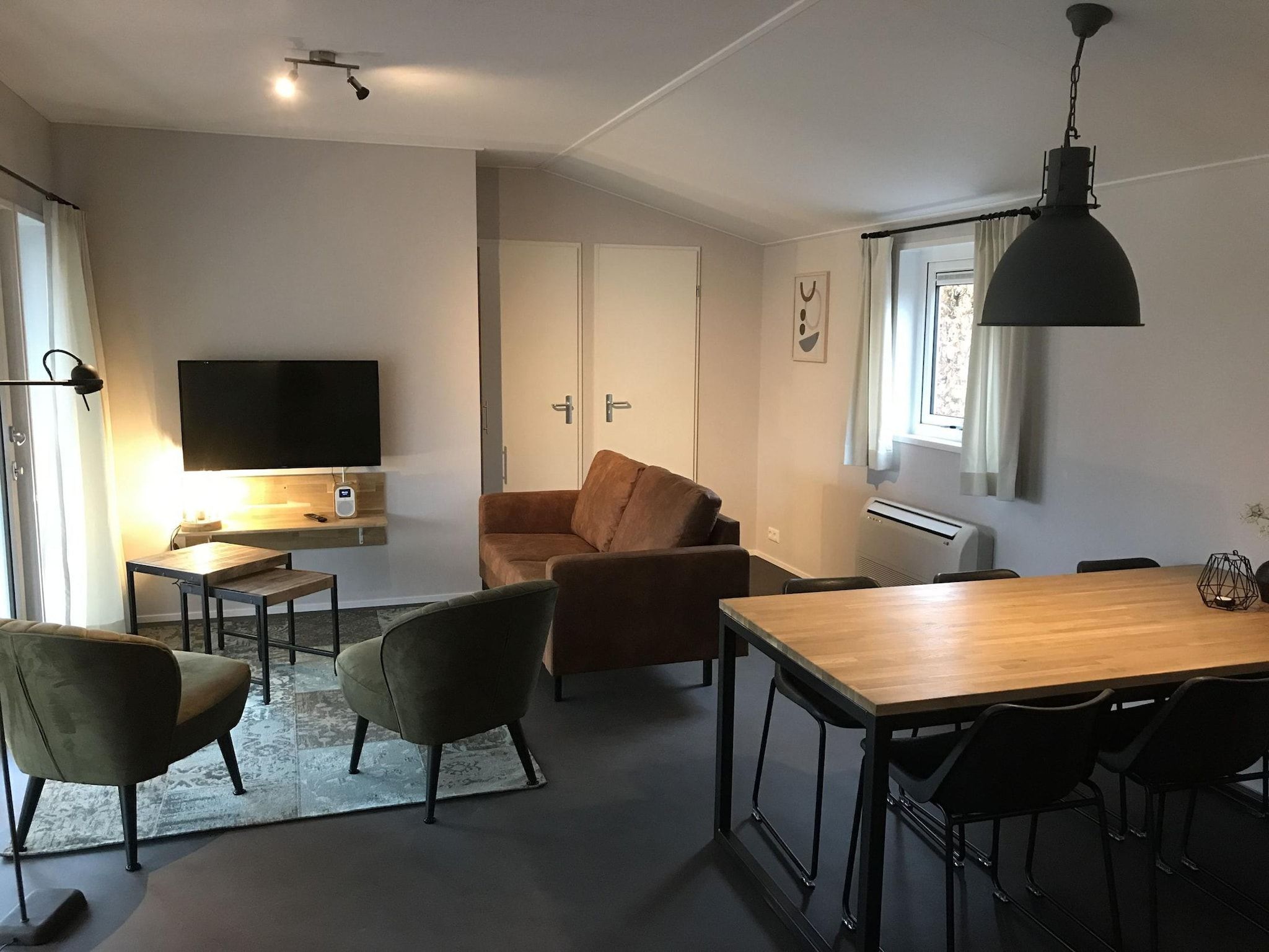 De woonkamer van Vakantiepark de Tabaksschuur 3 in Elst