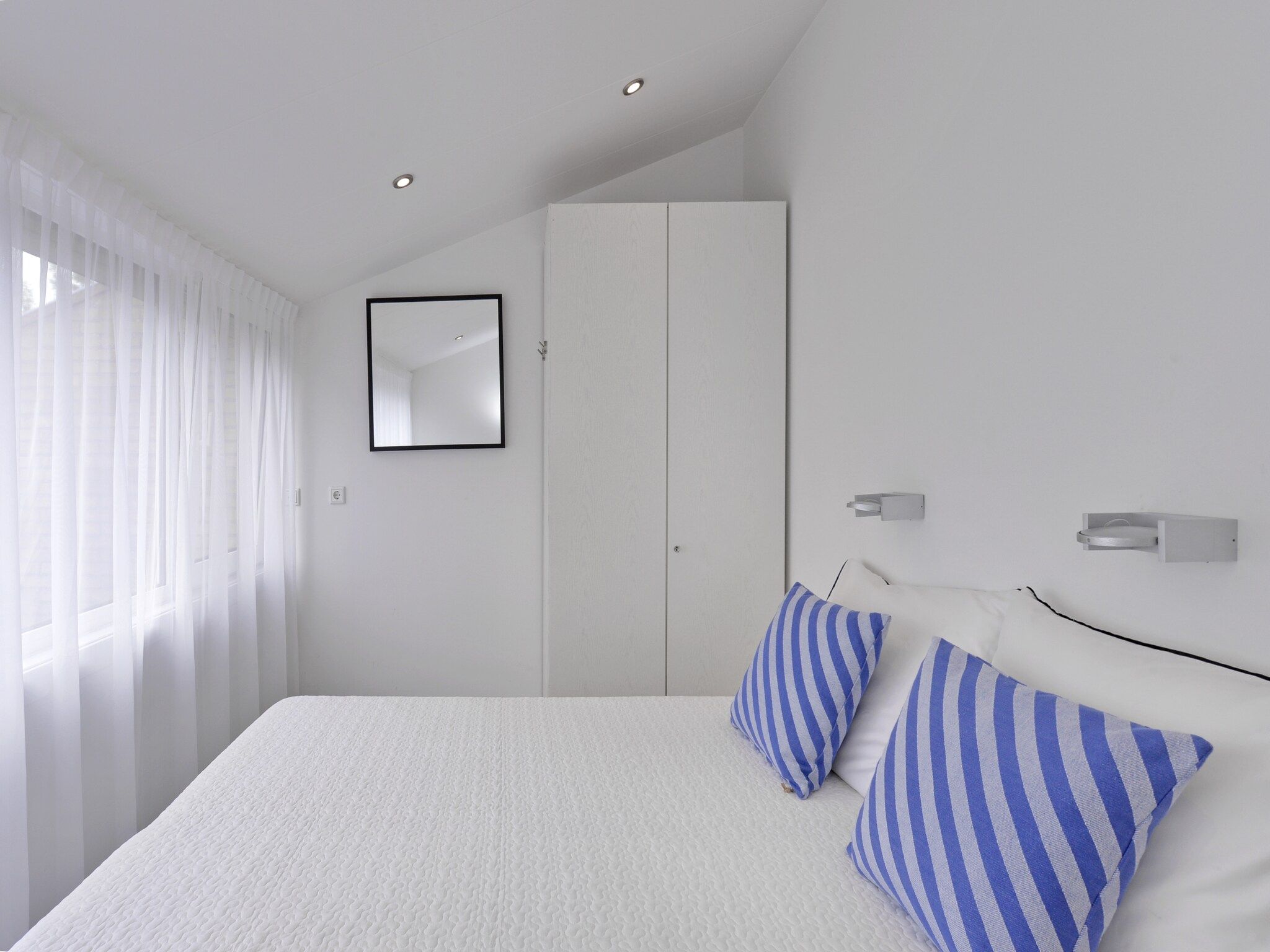 Een slaapkamer van Havenweg 12 in Kamperland