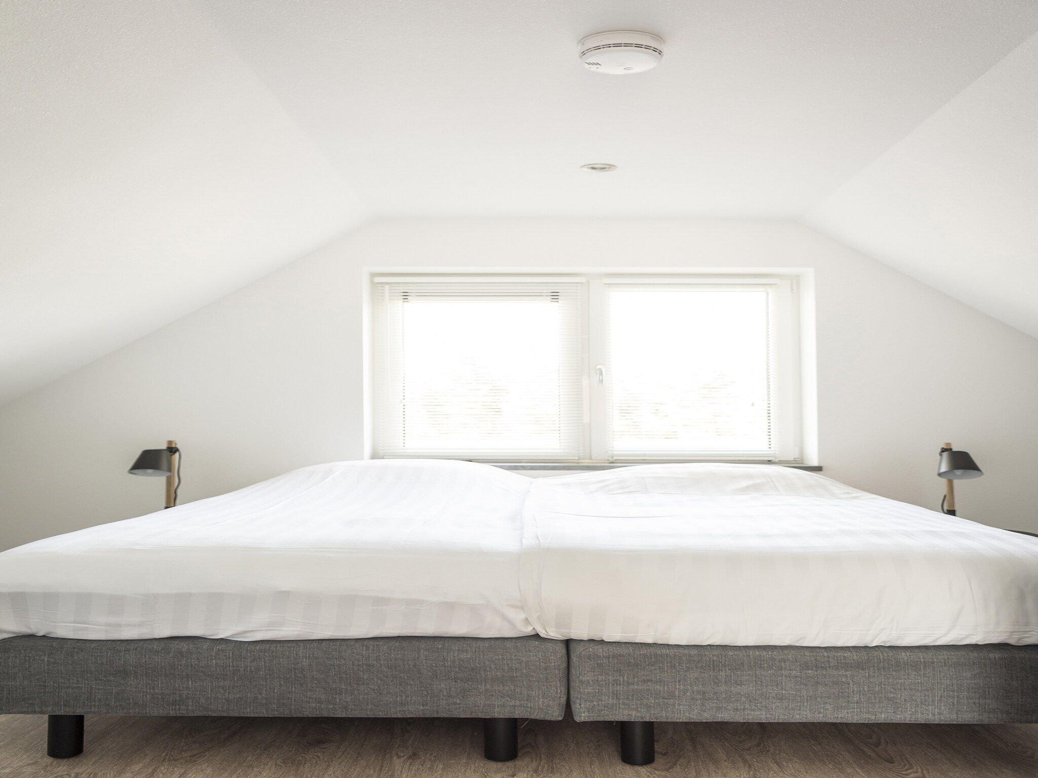 Een slaapkamer van Landhuis Bouwlust K in De Cocksdorp Texel