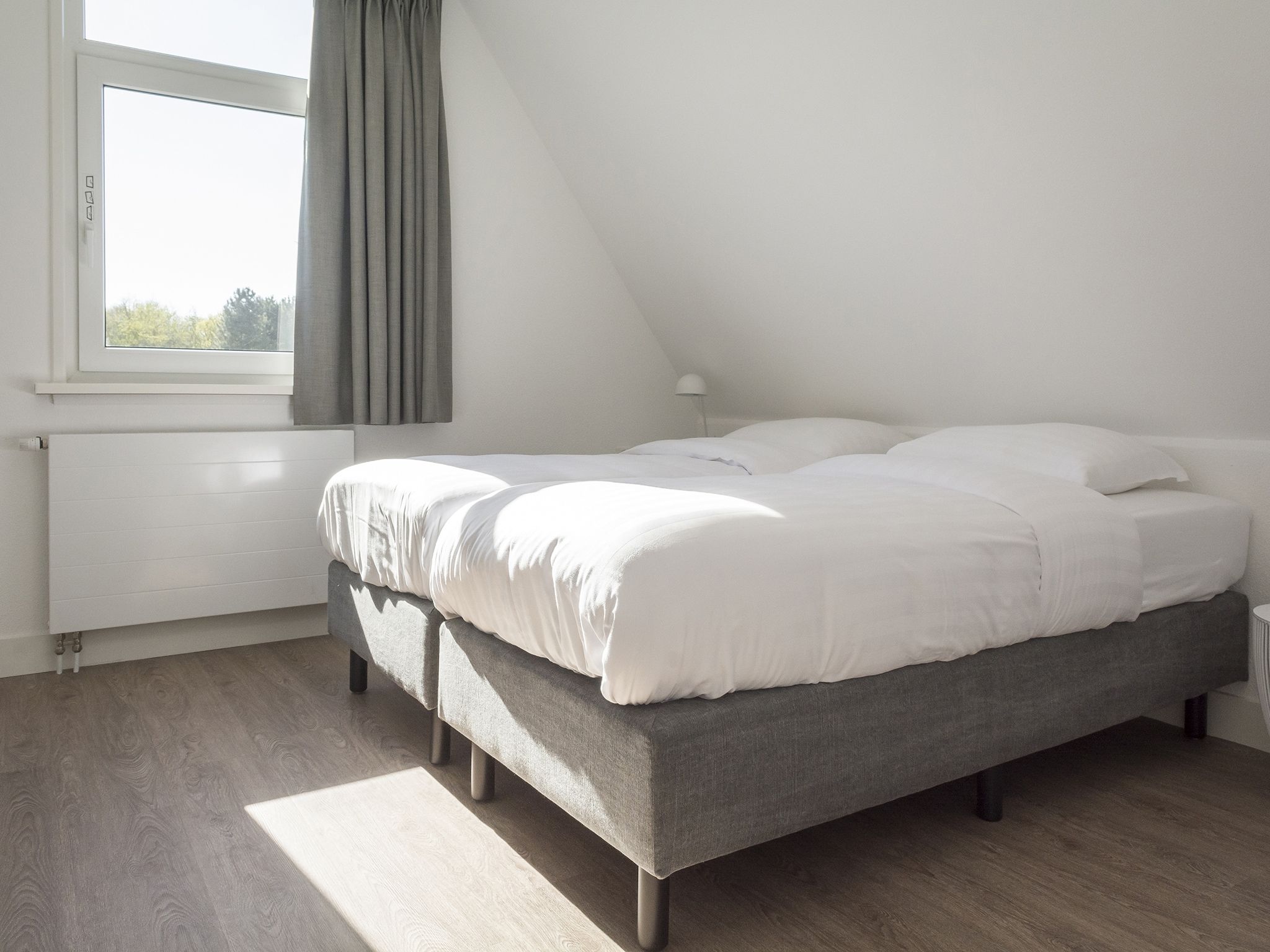 Een slaapkamer van Bouwlust E11 in De Cocksdorp Texel