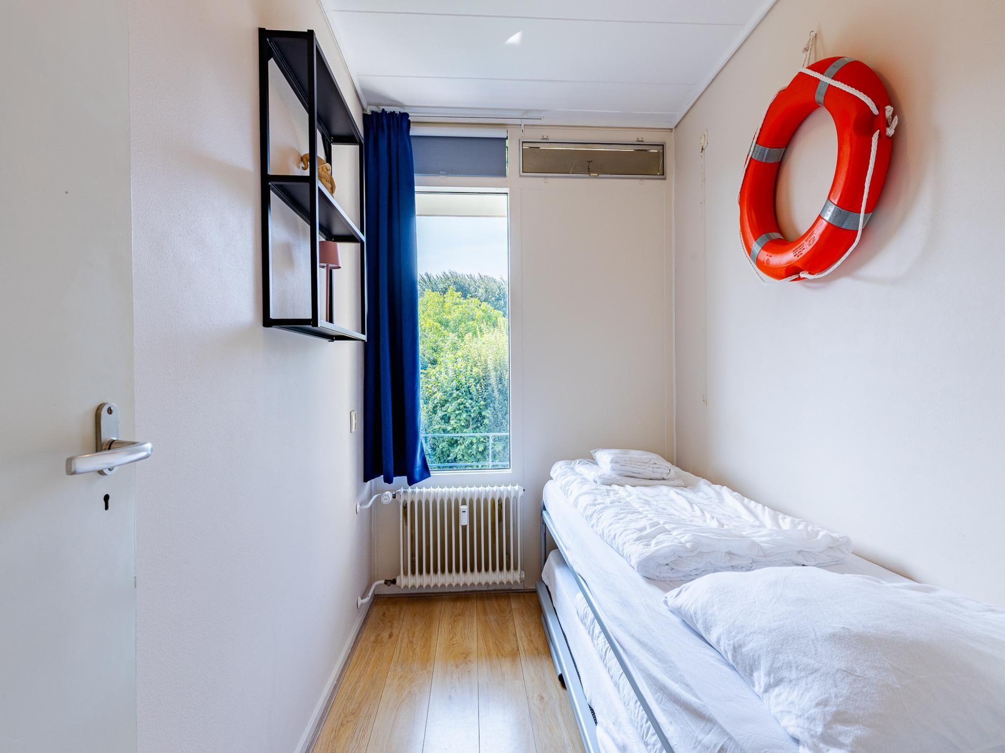 Een slaapkamer van Appartement Burg van Woelderenlaan in Vlissingen