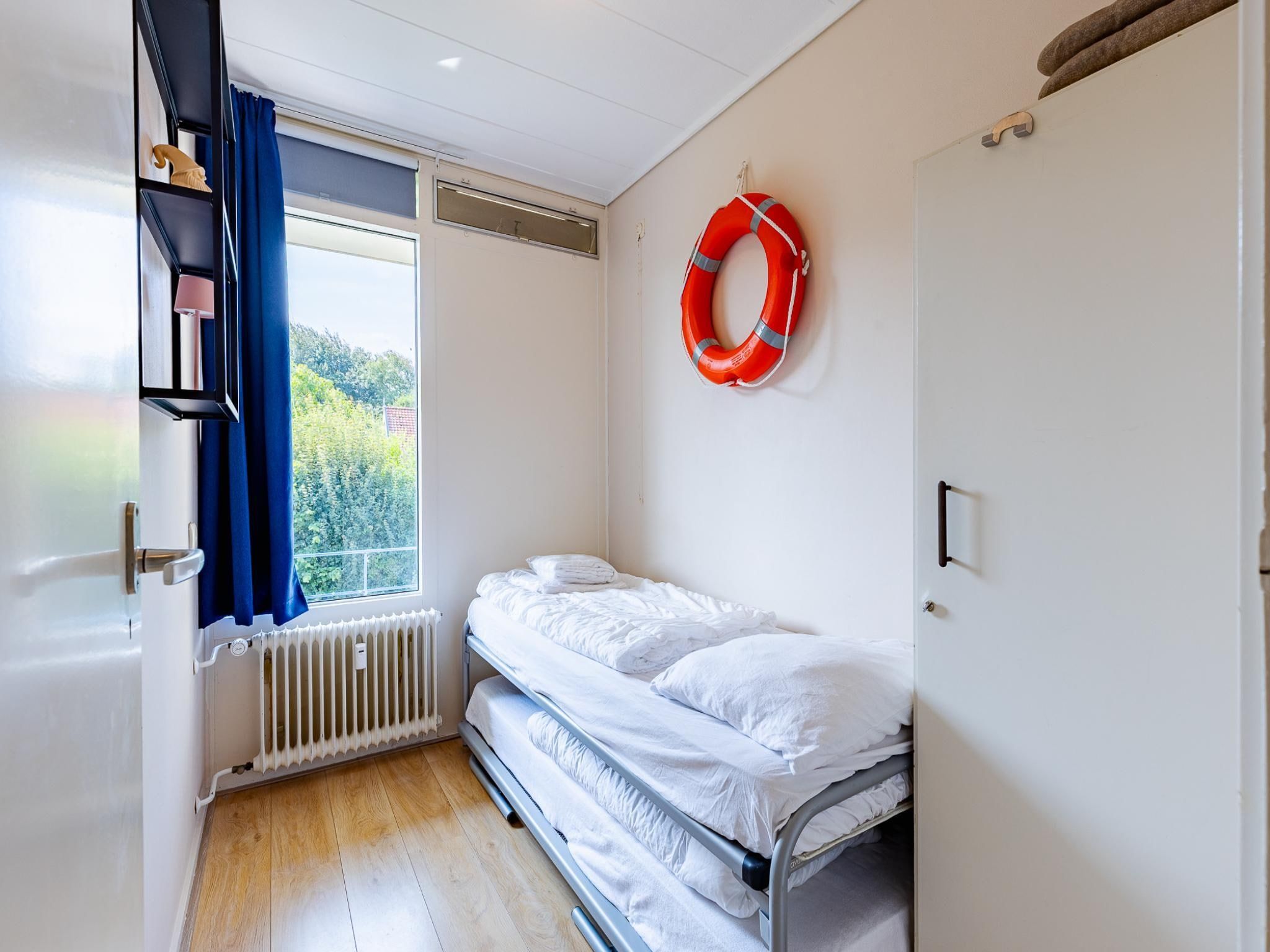 Een slaapkamer van Appartement Burg van Woelderenlaan in Vlissingen