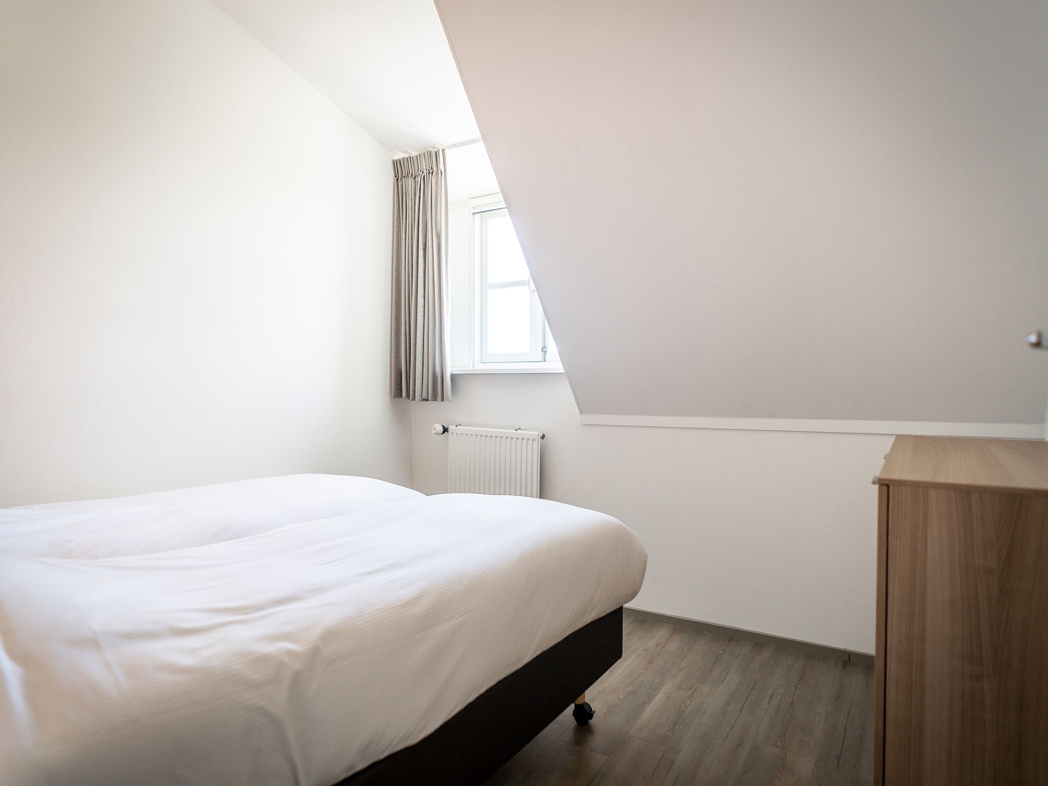 Een slaapkamer van App Hoeve Holland T3 in De Cocksdorp Texel