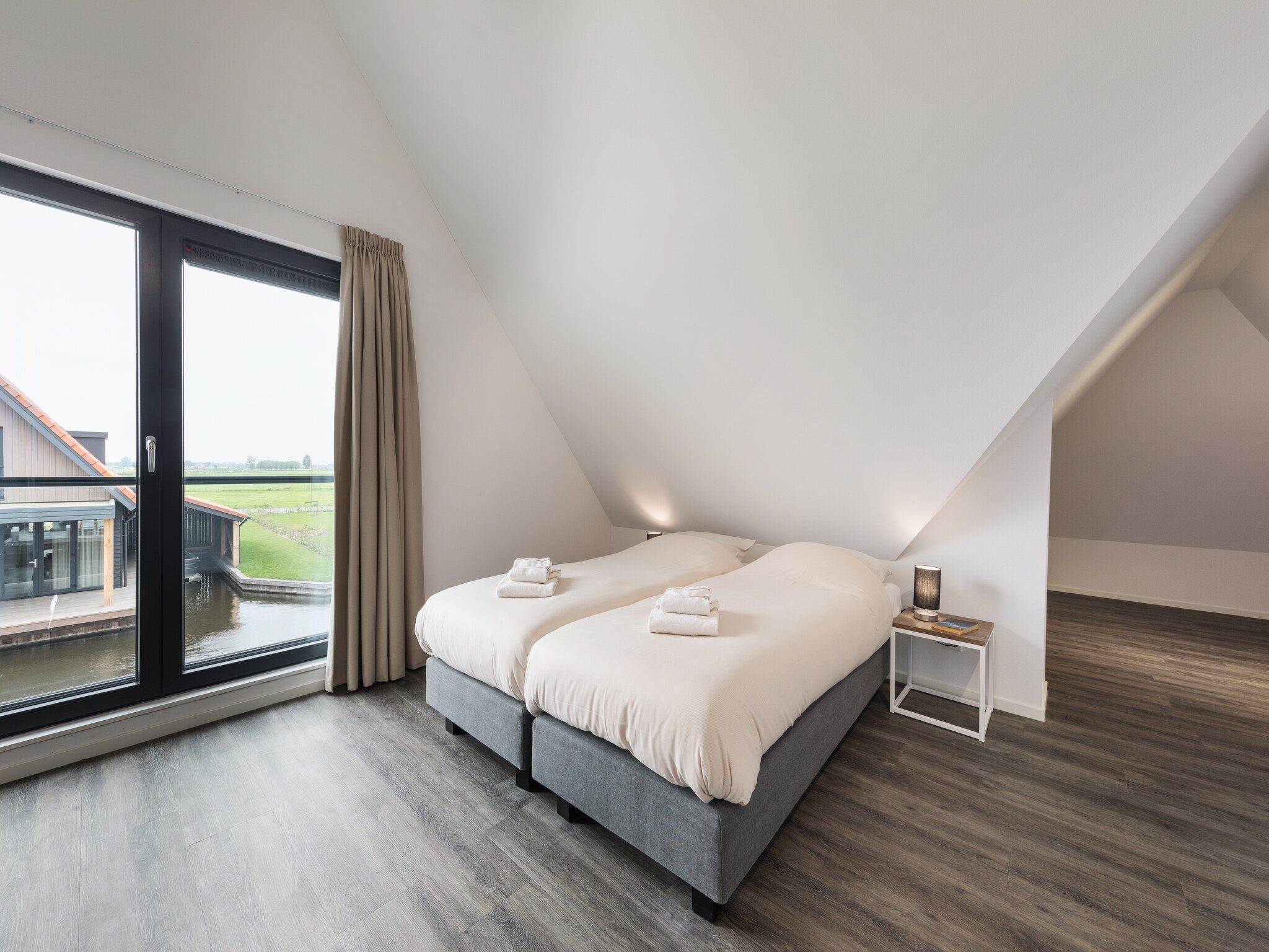 Een slaapkamer van Waterstaete Ossenzijl 2 in Ossenzijl