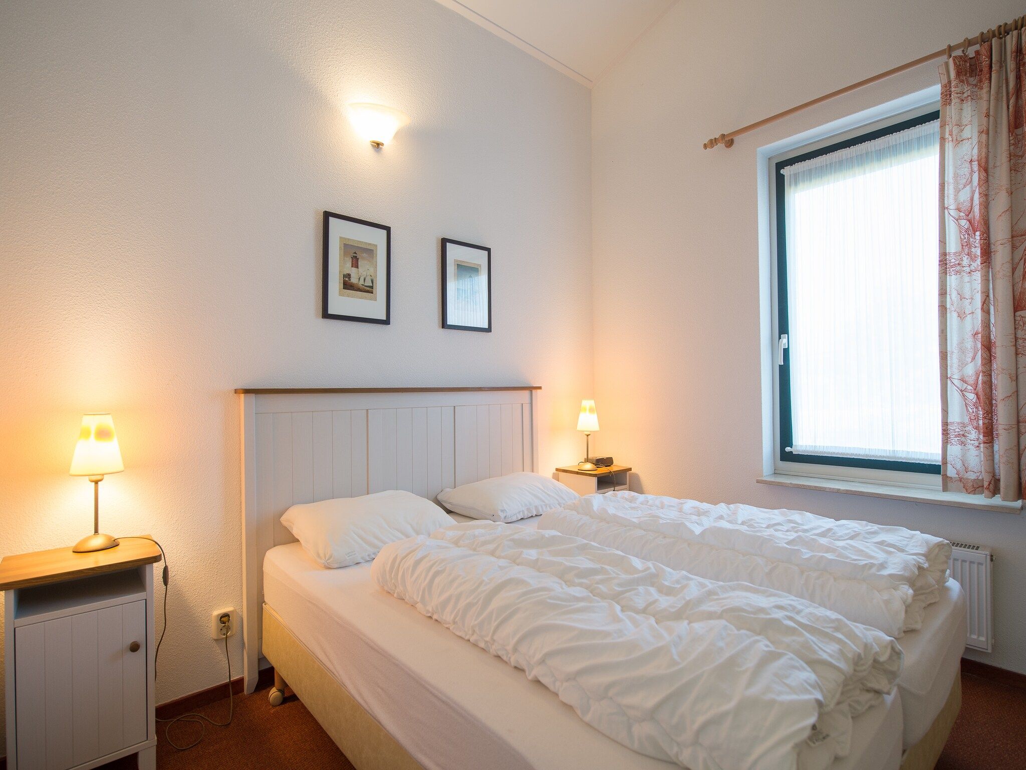 Een slaapkamer van Vakantiepark Boomhiemke 13 in Hollum