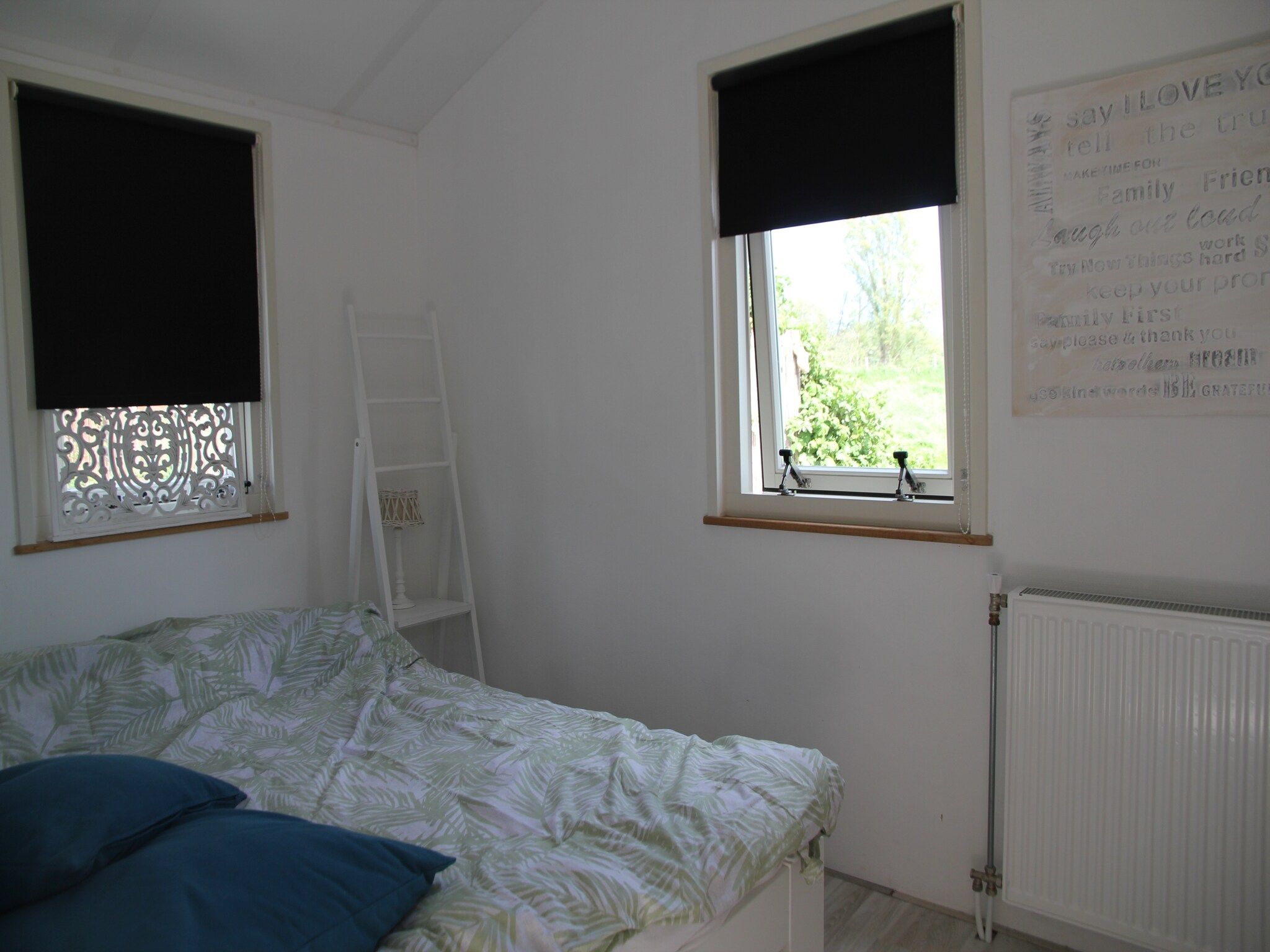 Een slaapkamer van Landelijk bij Zee in Warmenhuizen