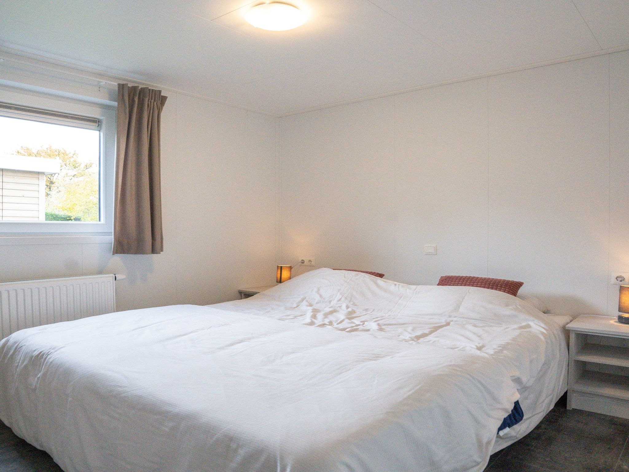 Een slaapkamer van Vakantiepark Mölke 19 in Zuna