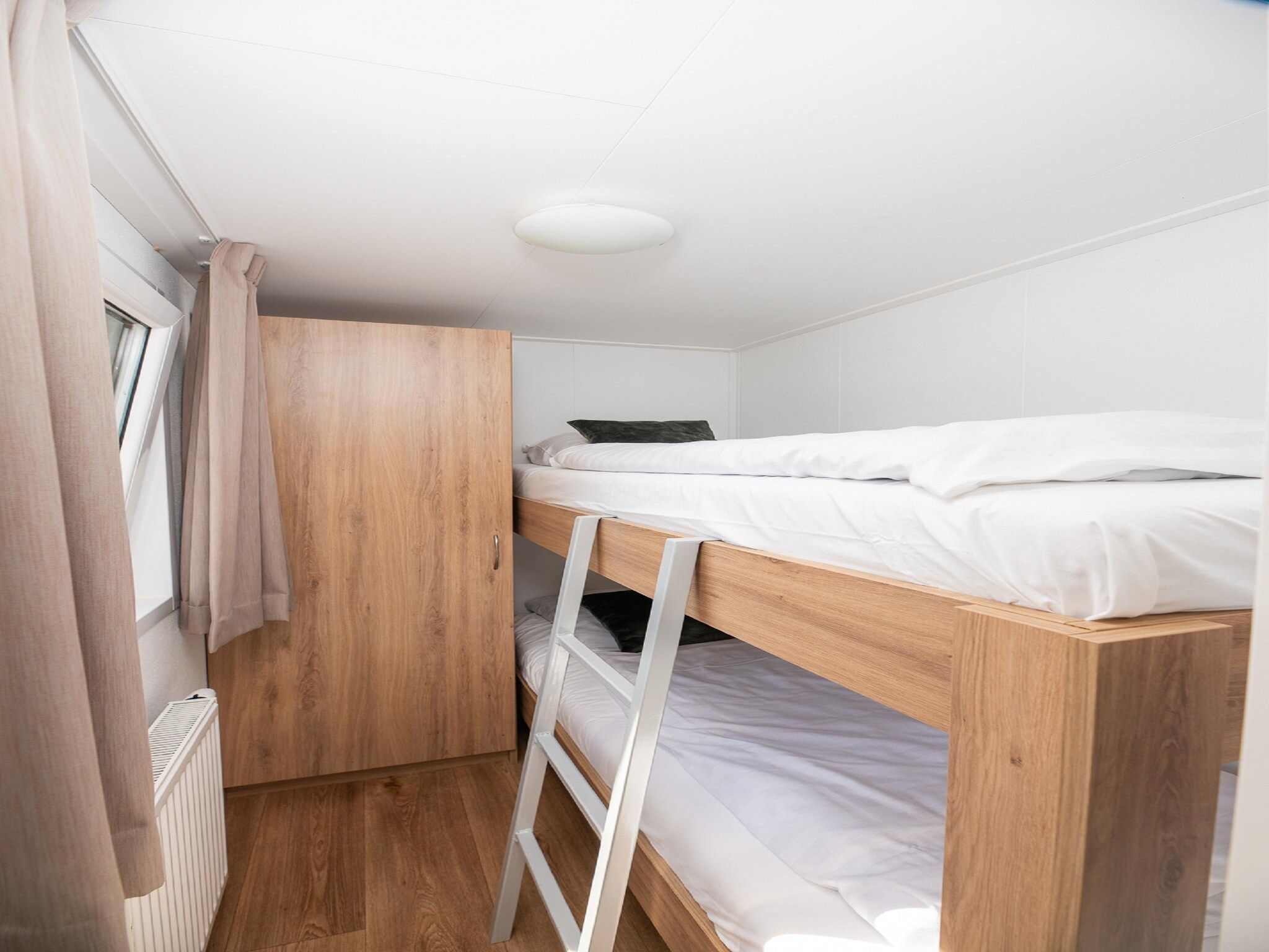 Een slaapkamer van Vakantiepark Mölke 20 in Zuna