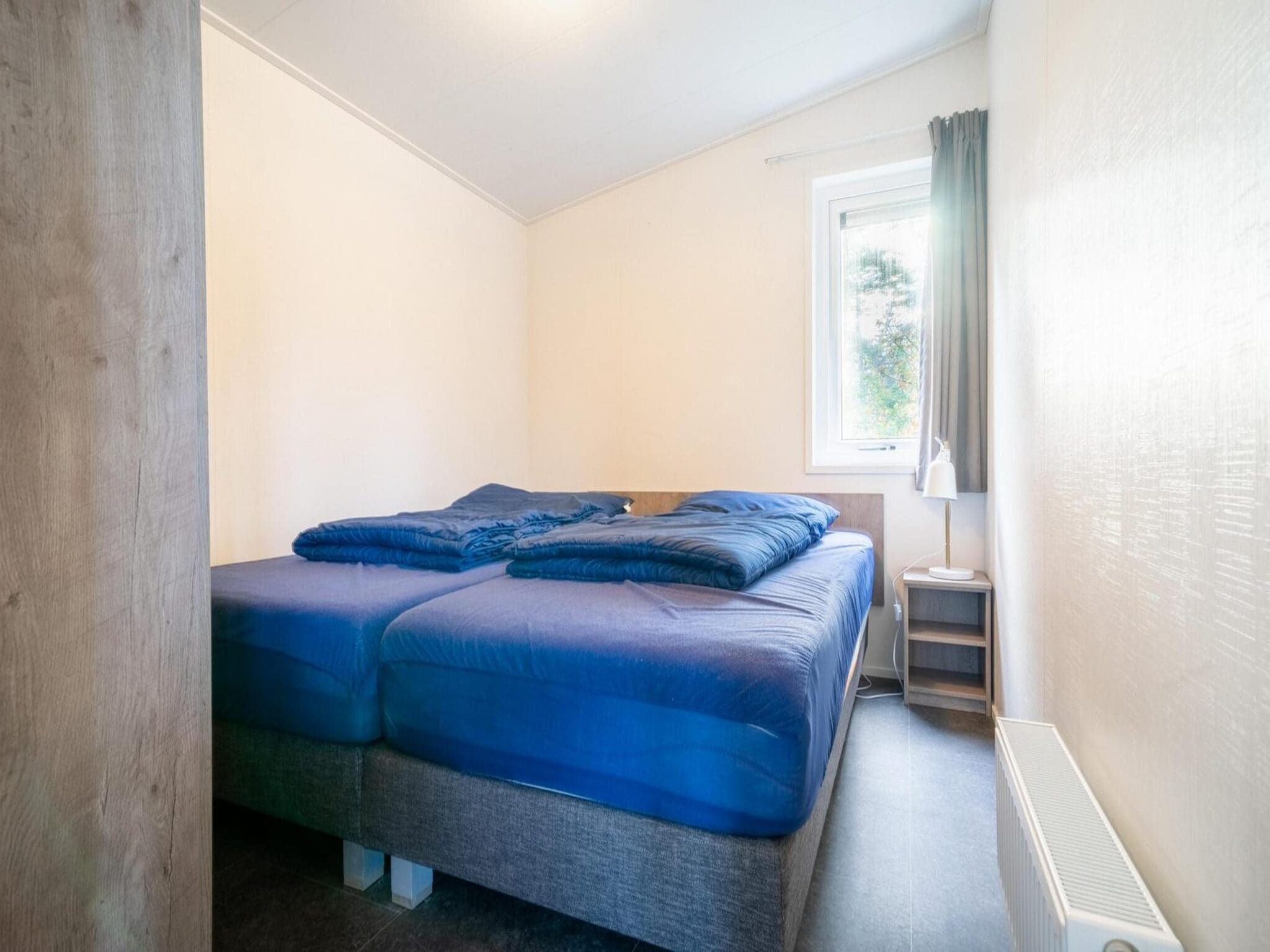 Een slaapkamer van Pavilion 5 in Otterlo