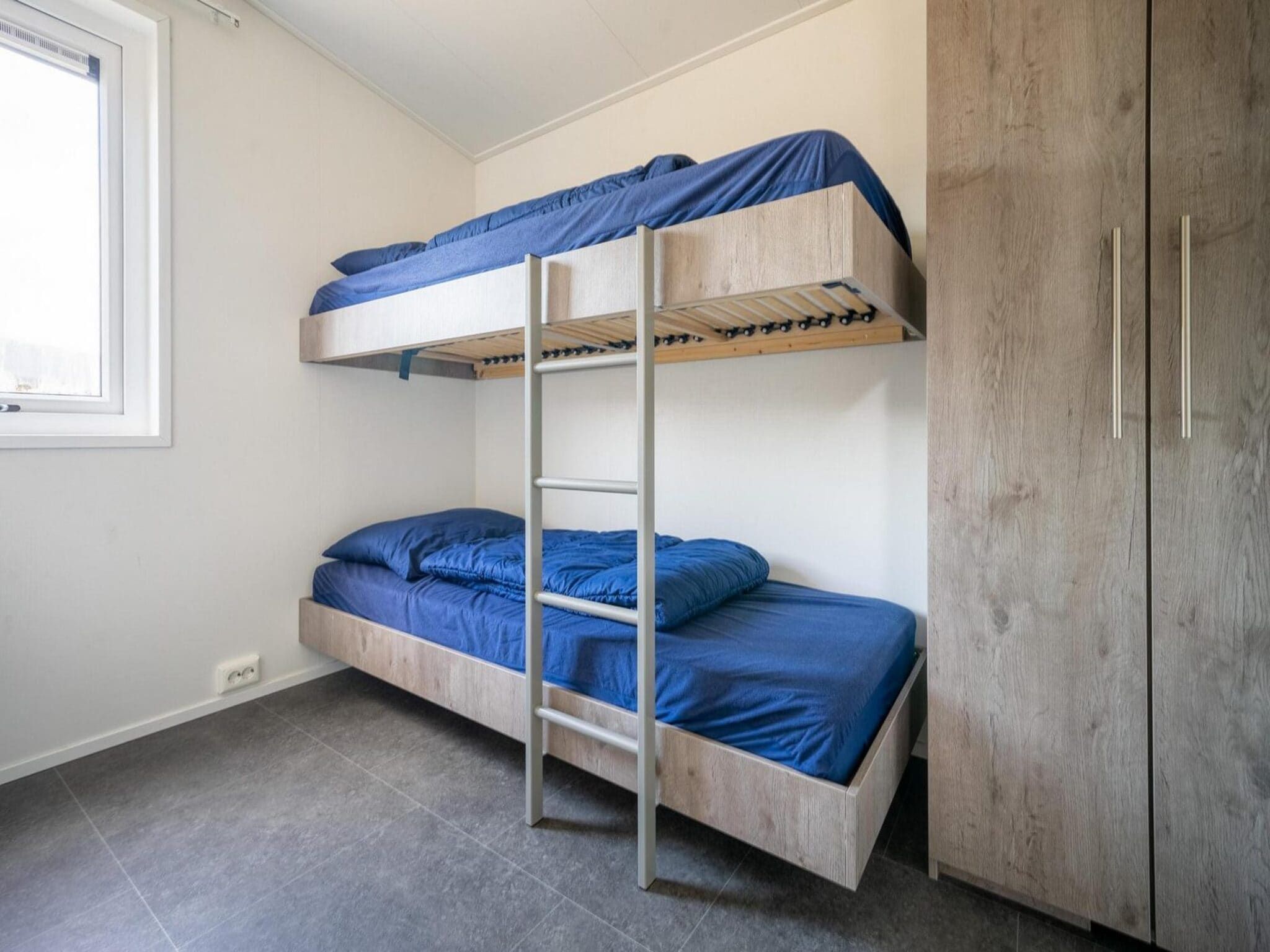 Een slaapkamer van Pavilion 5 in Otterlo